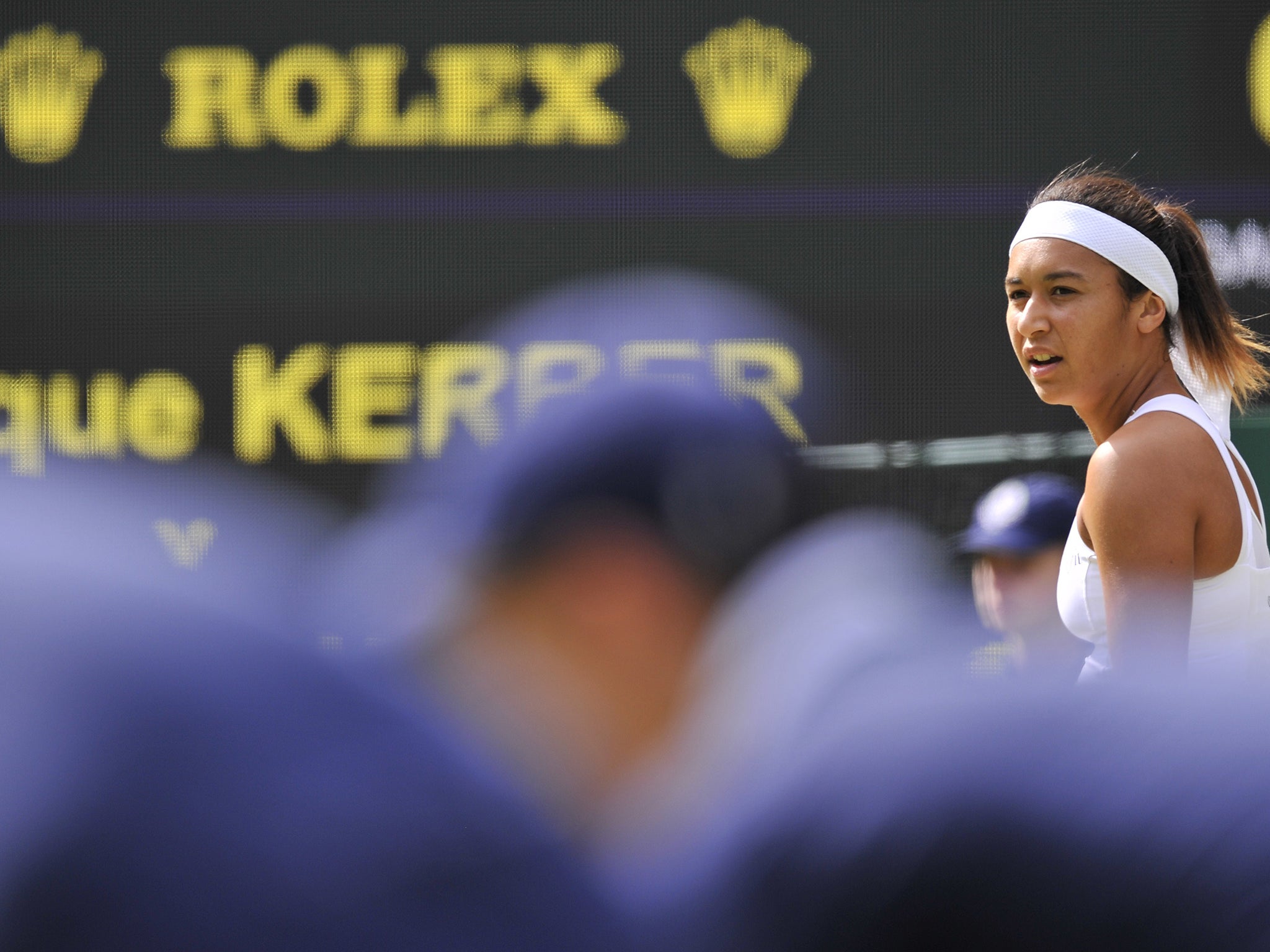 Britain's Heather Watson (R) looks on during her women's singles second round defeat to Germany's Angelique Kerber