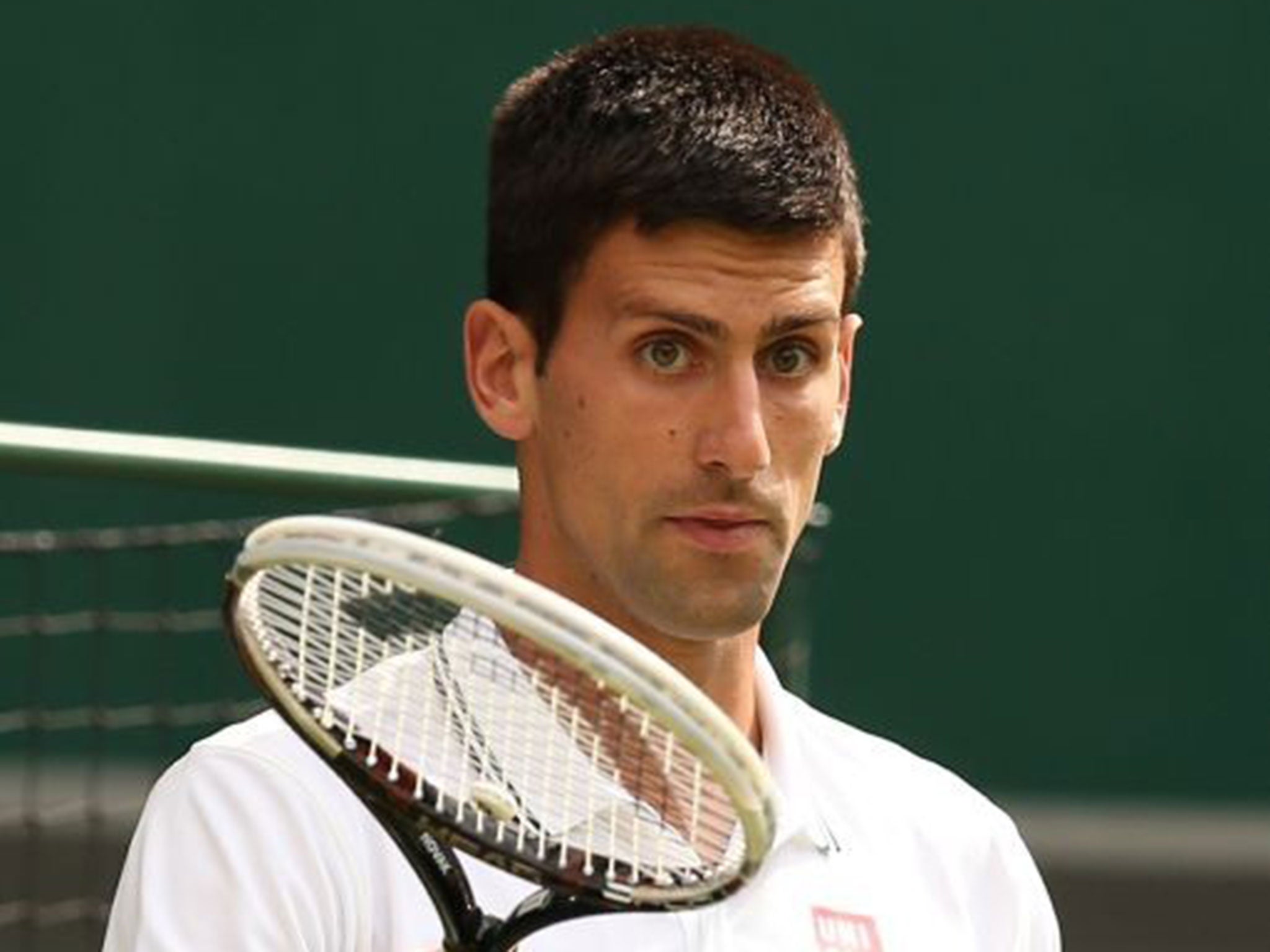 Protection racket: When Djokovic steps out in front of the crowd he is stony-faced