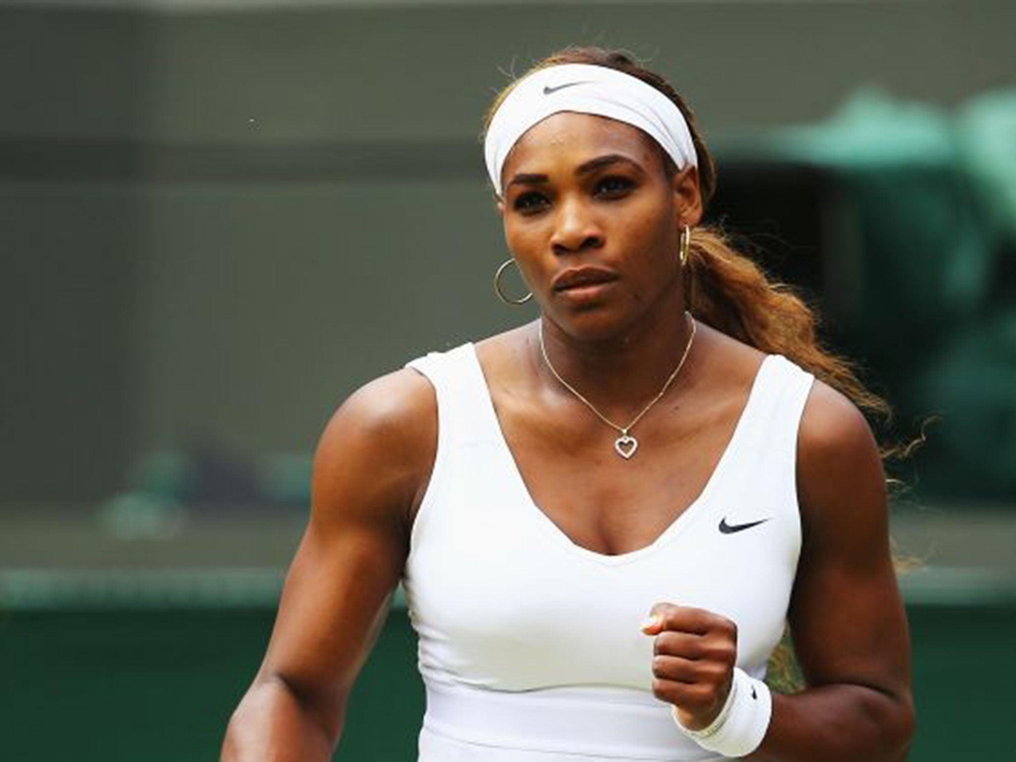 Fist of power: Virginia Williams said the game had become more dull since Serena Williams (pictured) and her sister raised the bar (Getty)