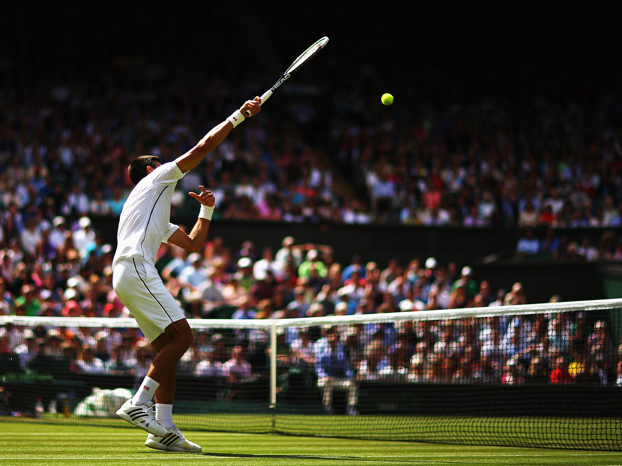 Novak Djokovic in action against Gilles Simon