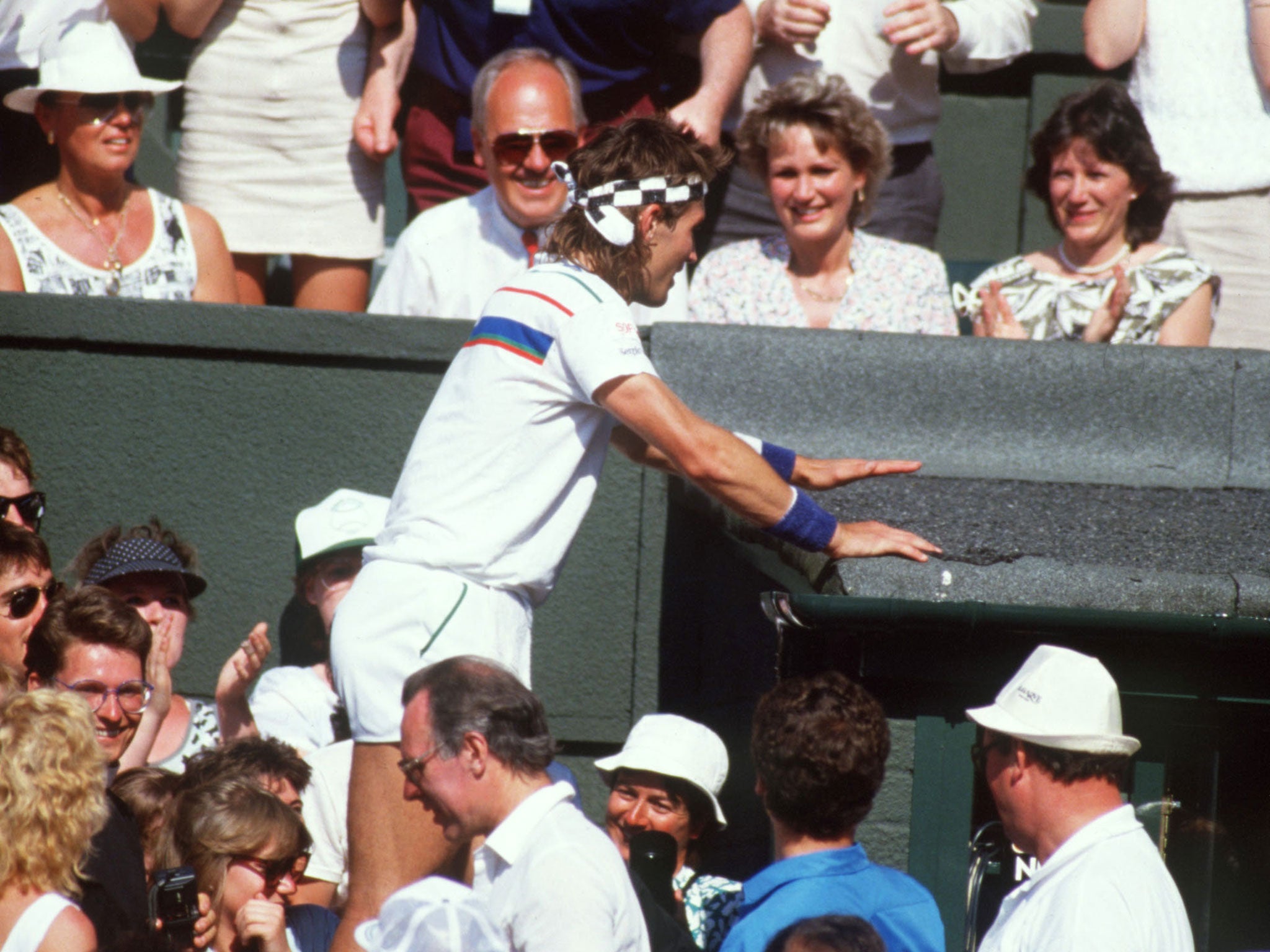 Pat Cash clambered into the crowd following his win against Ivan Lendl at Wimbledon in 1987