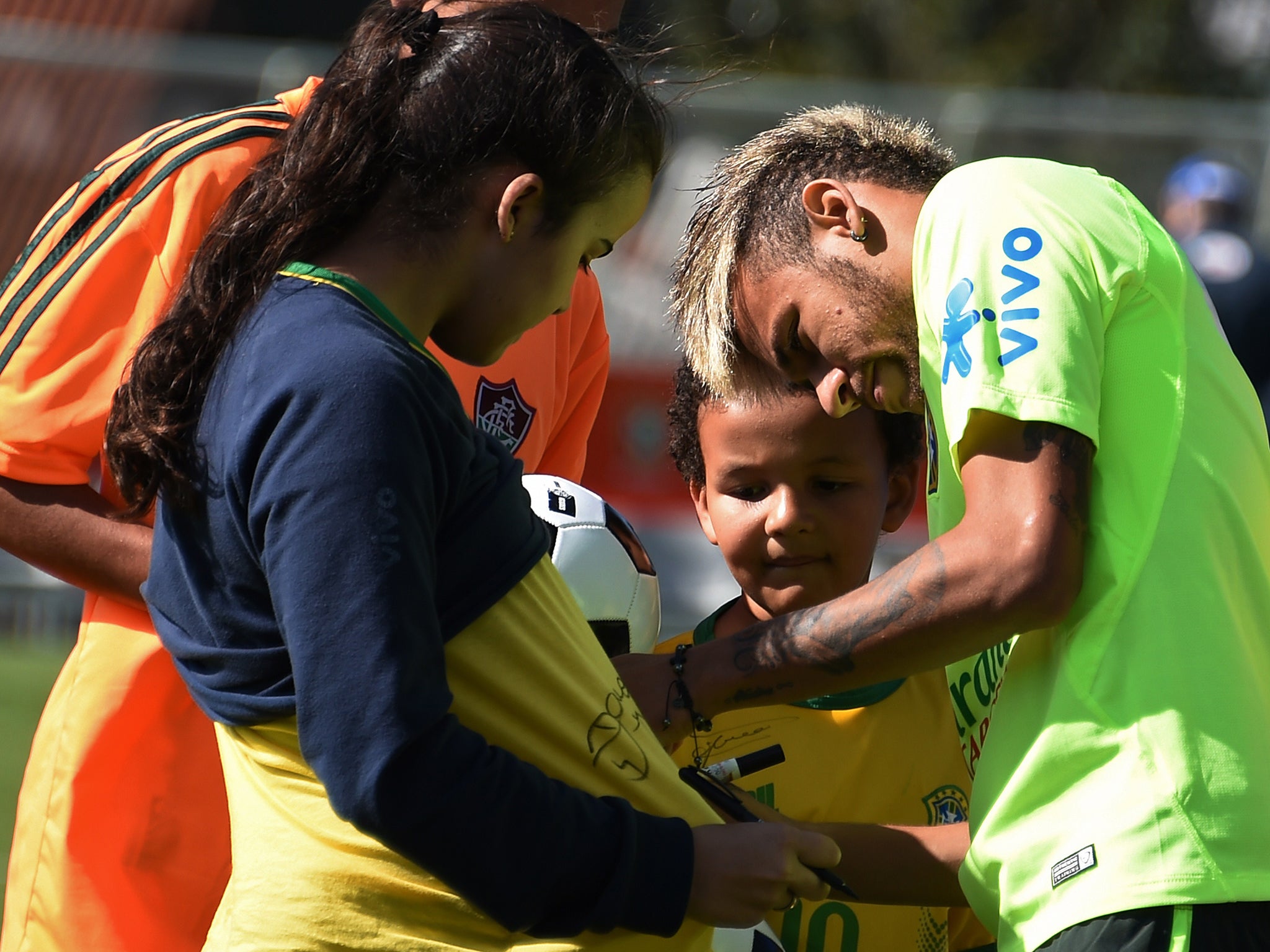 Neymar signs autographs for fans