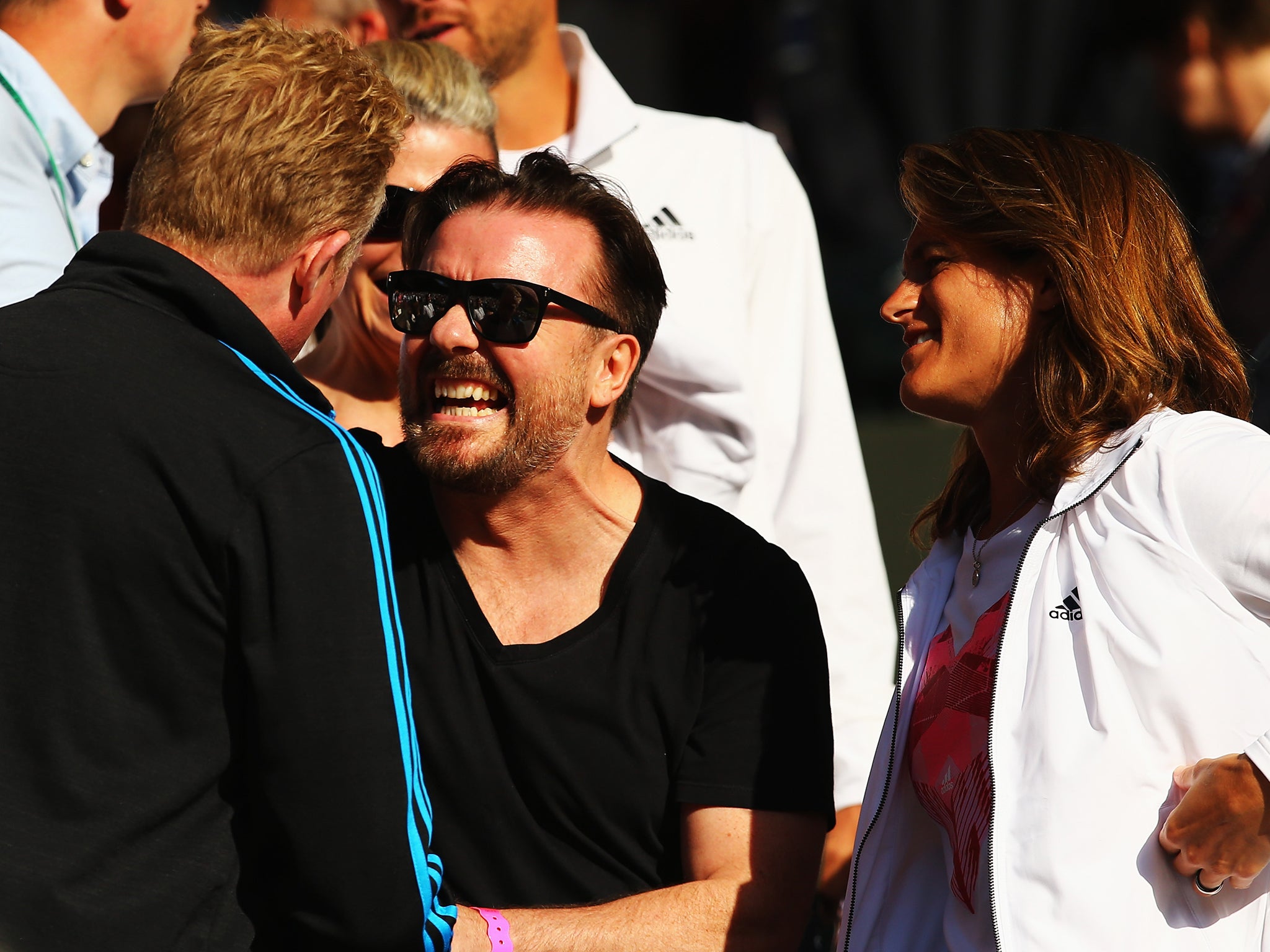 Ricky Gervais watches Andy Murray in action during his victory over Roberto Bautista