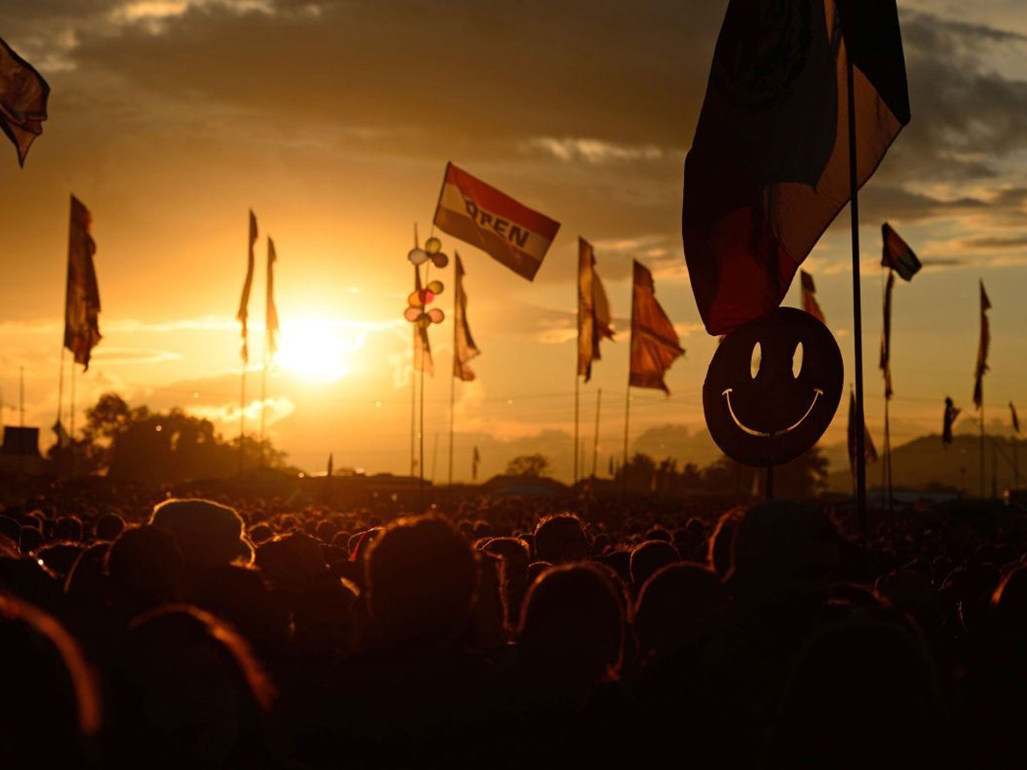 The sun sets at Glastonbury Festival on 27 June 2014.