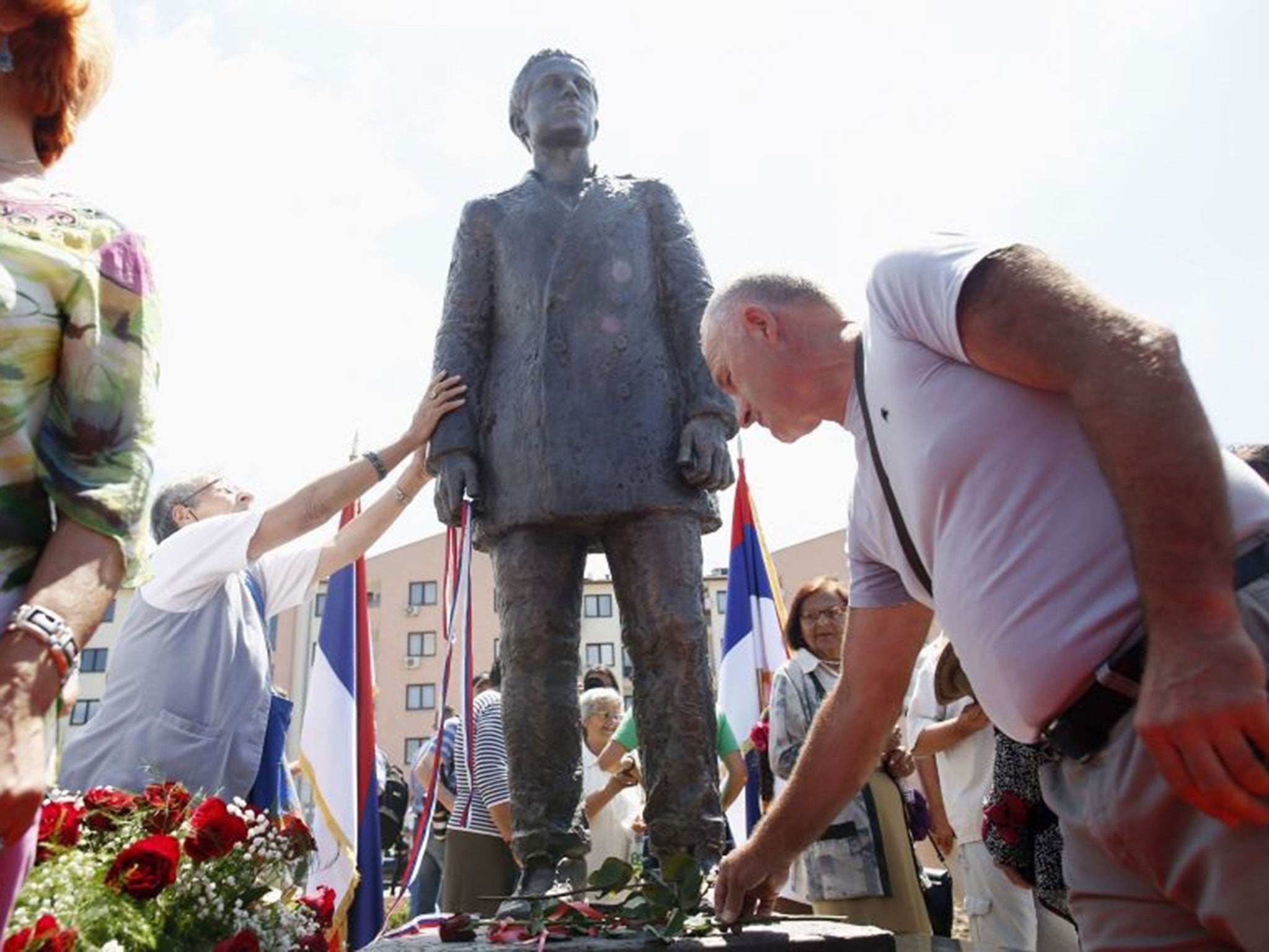 Bosnian Serbs lay flowers after the unveiling of a controversial statue of assassin Gavrilo Princip in East Sarajevo