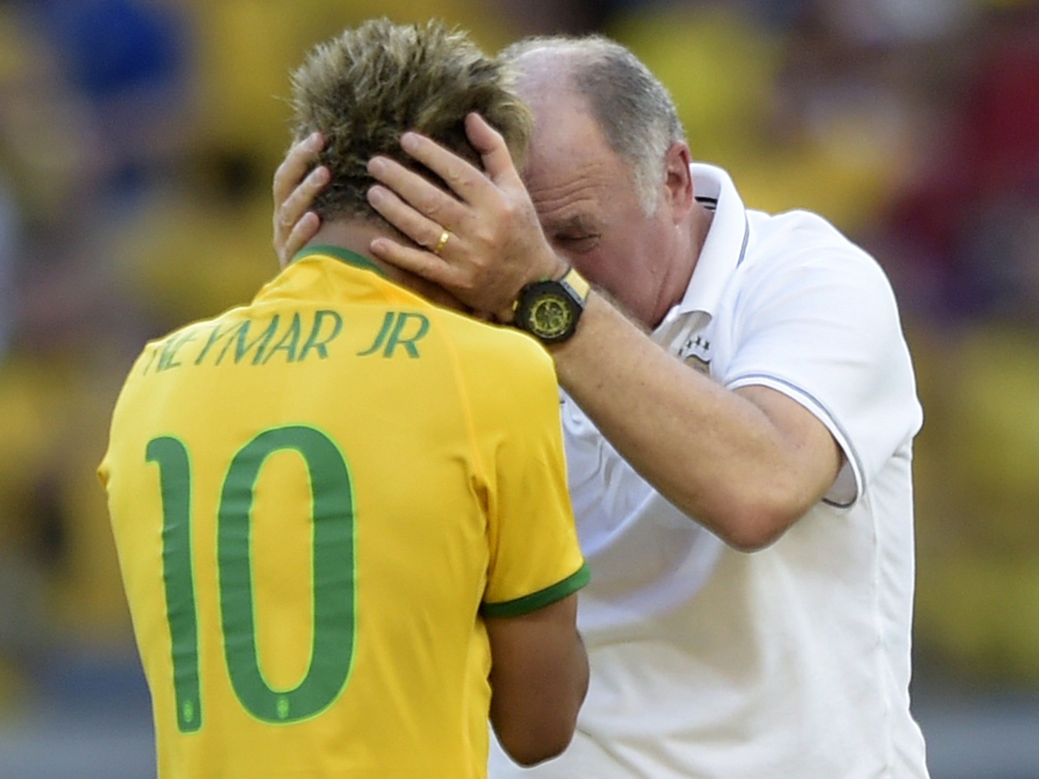 Luiz Felipe Scolari embraces the boy wonder after penalties