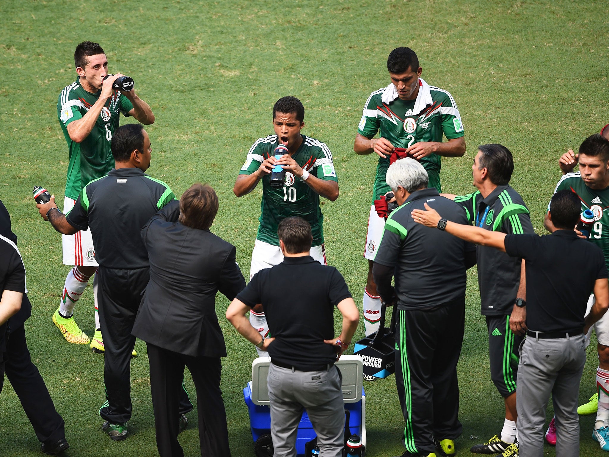 Mexico players take on water during their cooling break