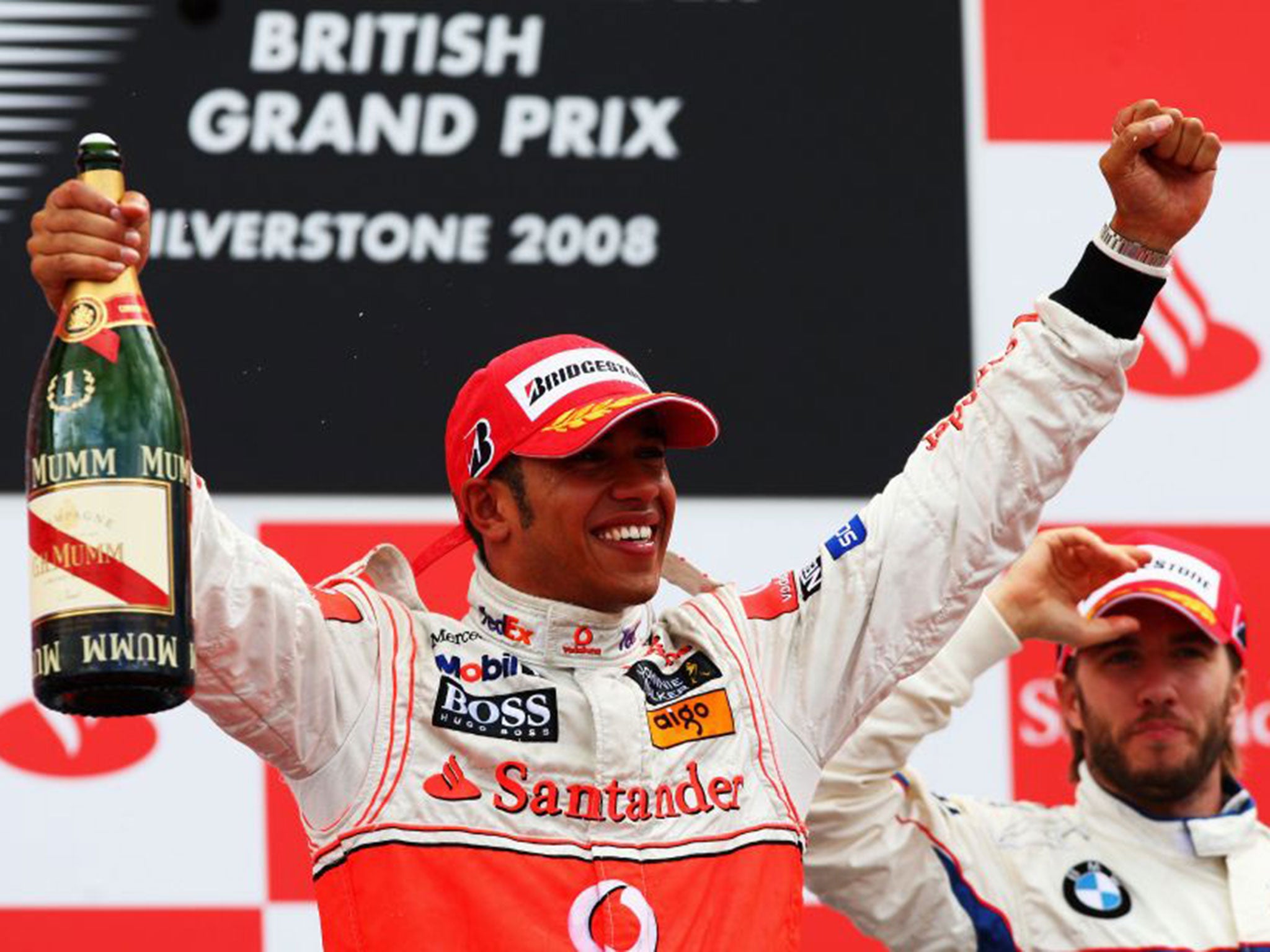 Hamilton celebrates his 2008 triumph at Silverstone