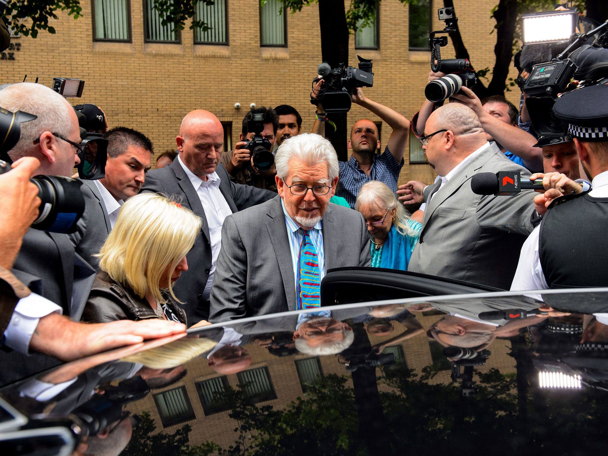 Rolf Harris leaves Southwark Crown Court after being found guilty of 12 sex charges involving four women