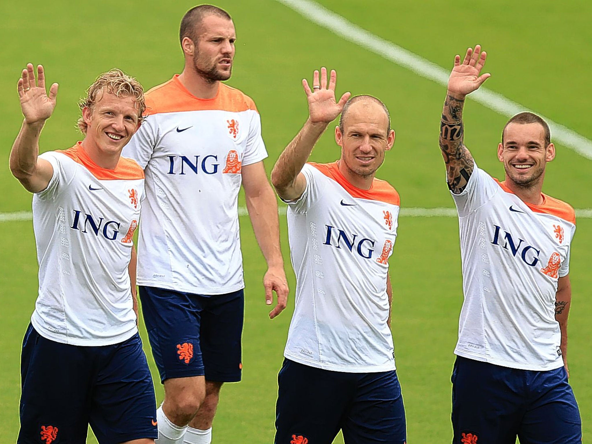 Dirk Kuyt, Ron Vlaar, Arjen Robben and Wesley Sneijder wave to their families during training