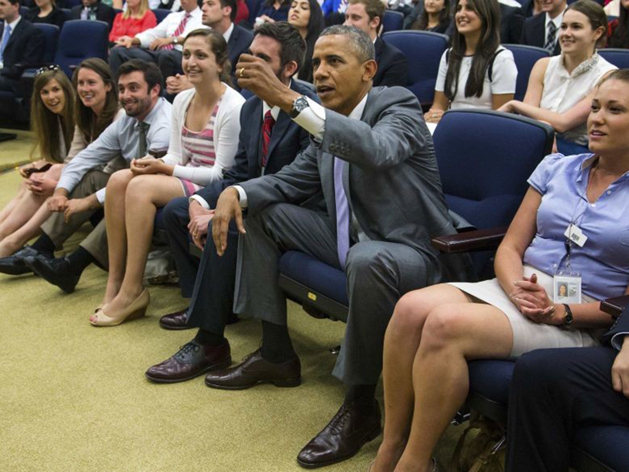 President Obama waves an imaginary red card after the a foul during Belgium's win over the US