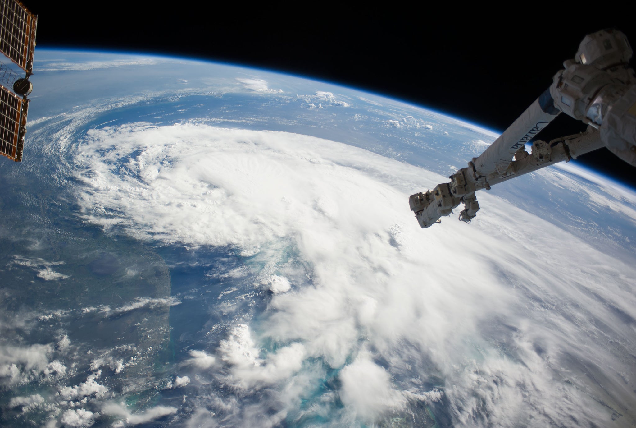 In this handout provided by NASA from the the Earth-orbiting International Space Station, weather system Arthur travels up the east coast of the United States in the Atlantic Ocean near Florida in space. The robotic arm of the Space Station Remote Manipul