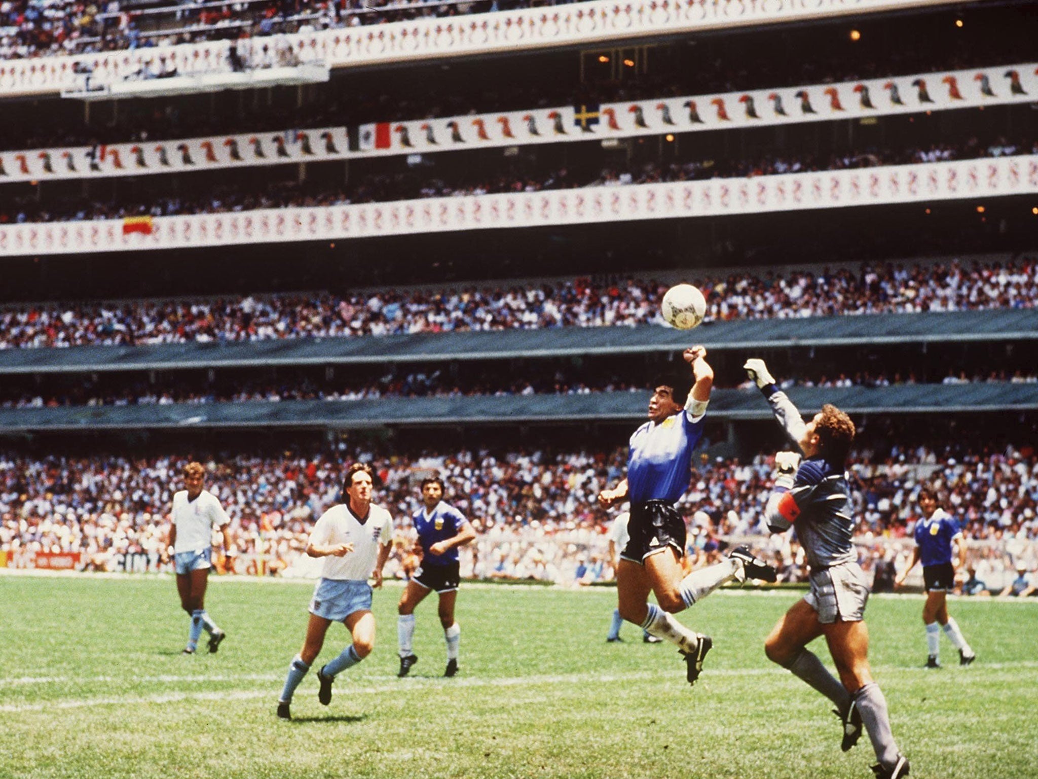 Diego Maradona scores his infamous ‘Hand of God’ goal against England in 1986