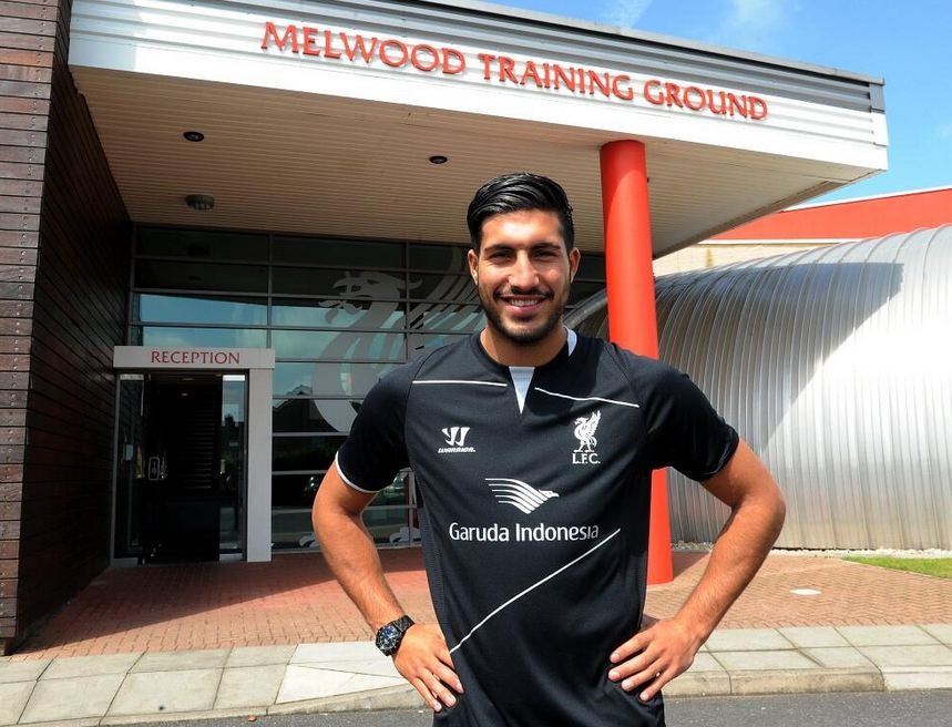 Emre Can pictured after signing