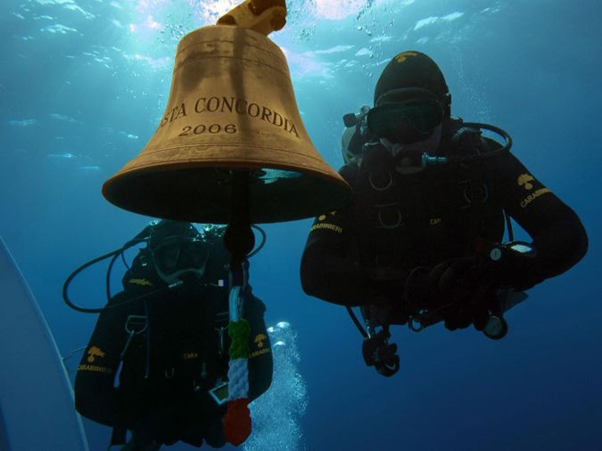 epa04297015 A picture released by the Italian Carabinieri on 03 July 2014 shows Carabinieri divers inspecting the inside of the Costa Concordia cruise ship, at Giglio Island, Italy, in 2012. The Costa Concordia hit a reef and partly capsized on 13 January