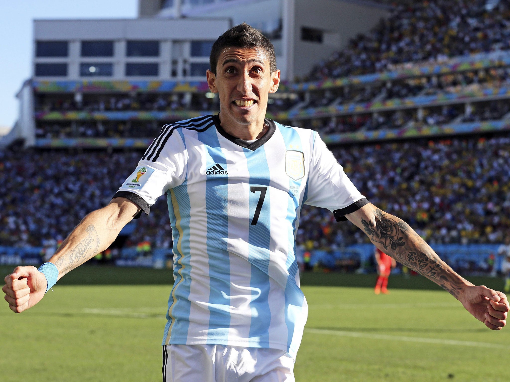 Angel Di Maria celebrates his winner against Switzerland