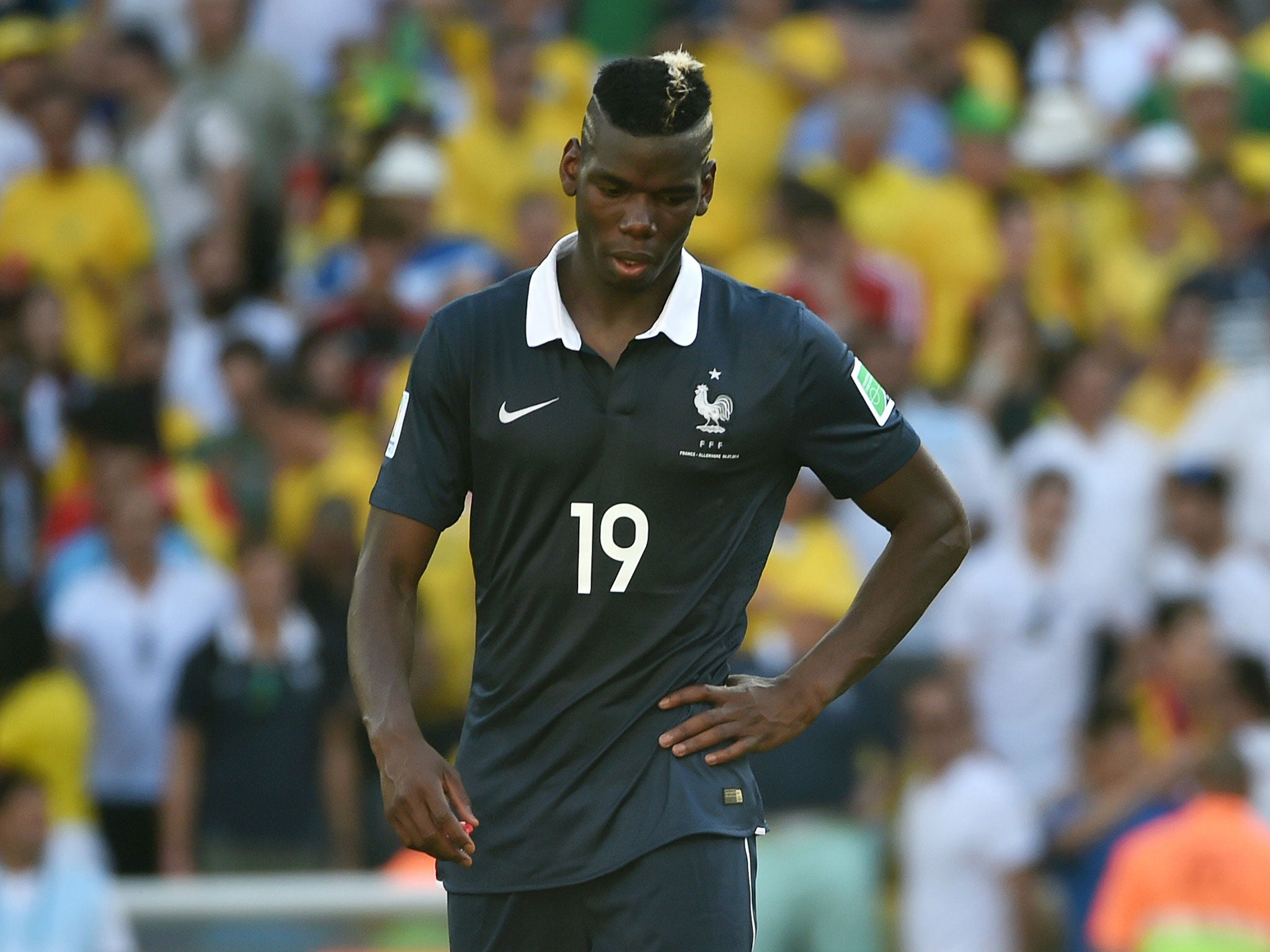 Paul Pogba is dejected after France lost to Germany in the World Cup quarter-final