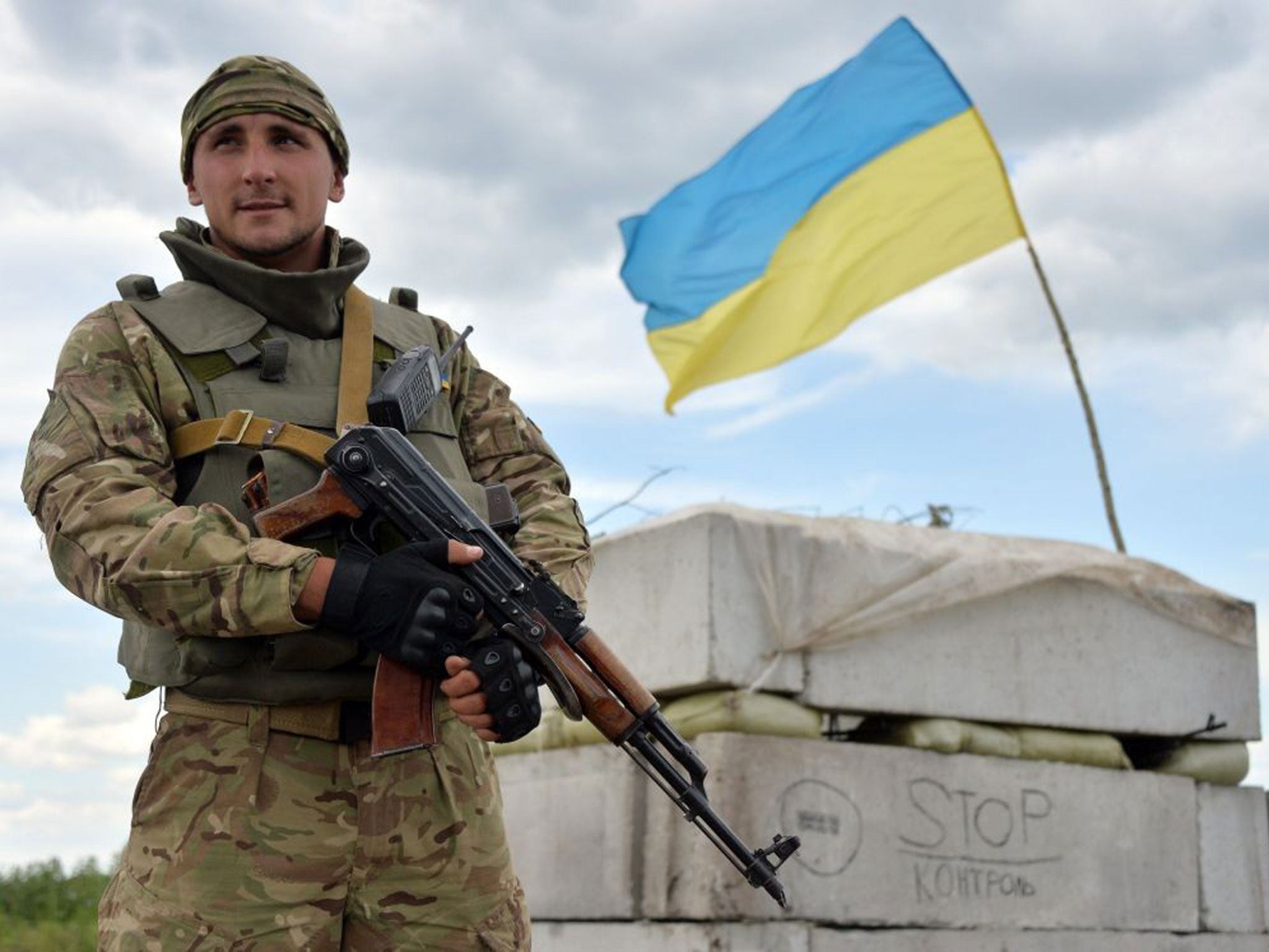 A Ukrainian forces serviceman guards their position at the check-point near Slavyansk