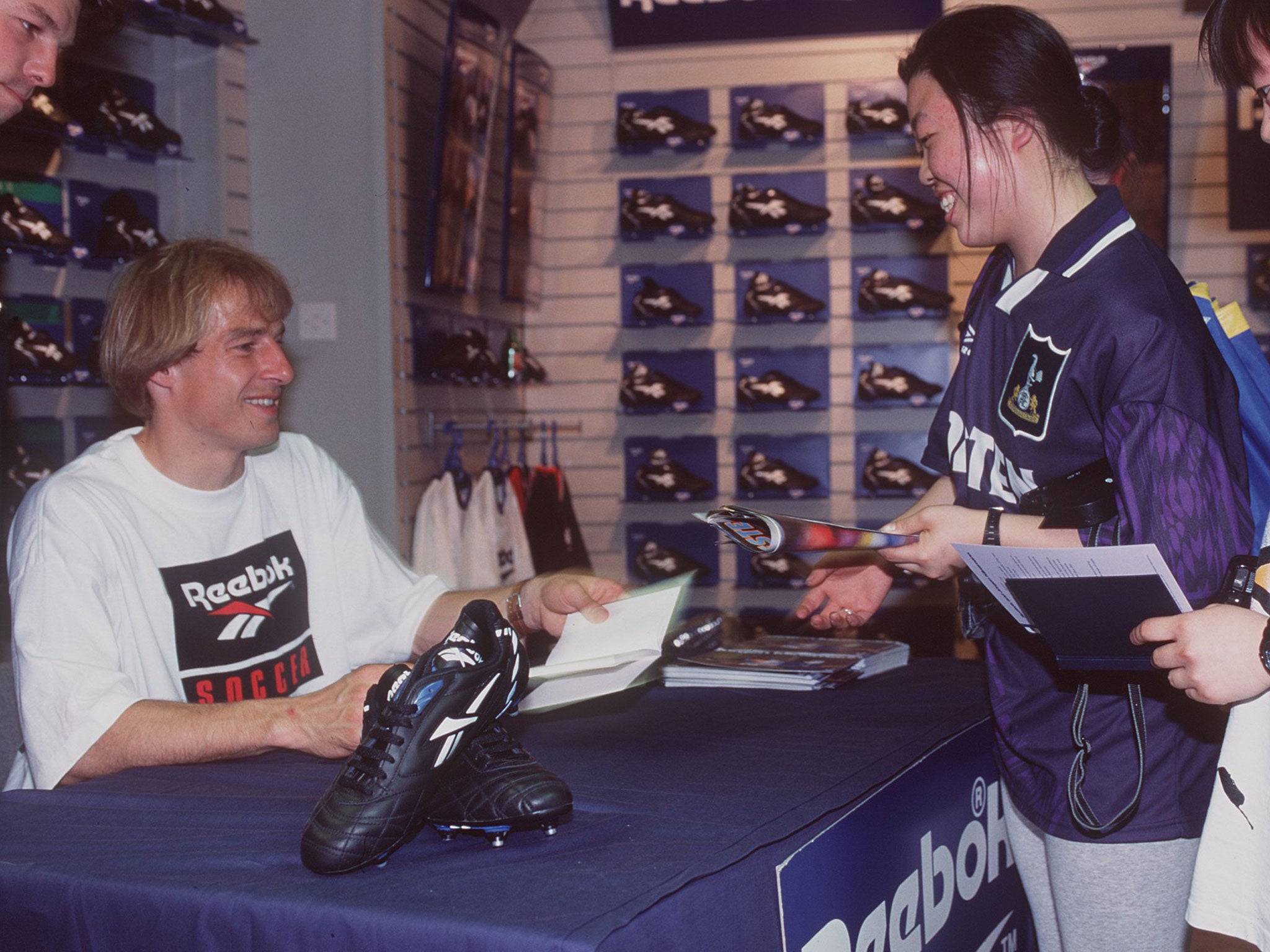 JUERGEN KLINSMANN OF TOTTENHAM HOTSPUR AND GERMANY HAPPILY SIGNS AUTOGRAPHS FOR FANS AS HE LAUNCHES HIS NEW BOOT, THE REEBOK KLINSMANN SUPREME, AT THE COBRA SPORTS STORE ON OXFORD STREET