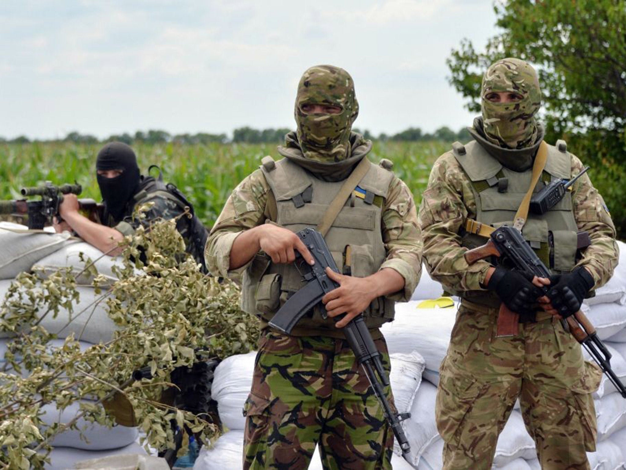 Ukrainian forces guard a checkpoint near Slovyansk on Friday