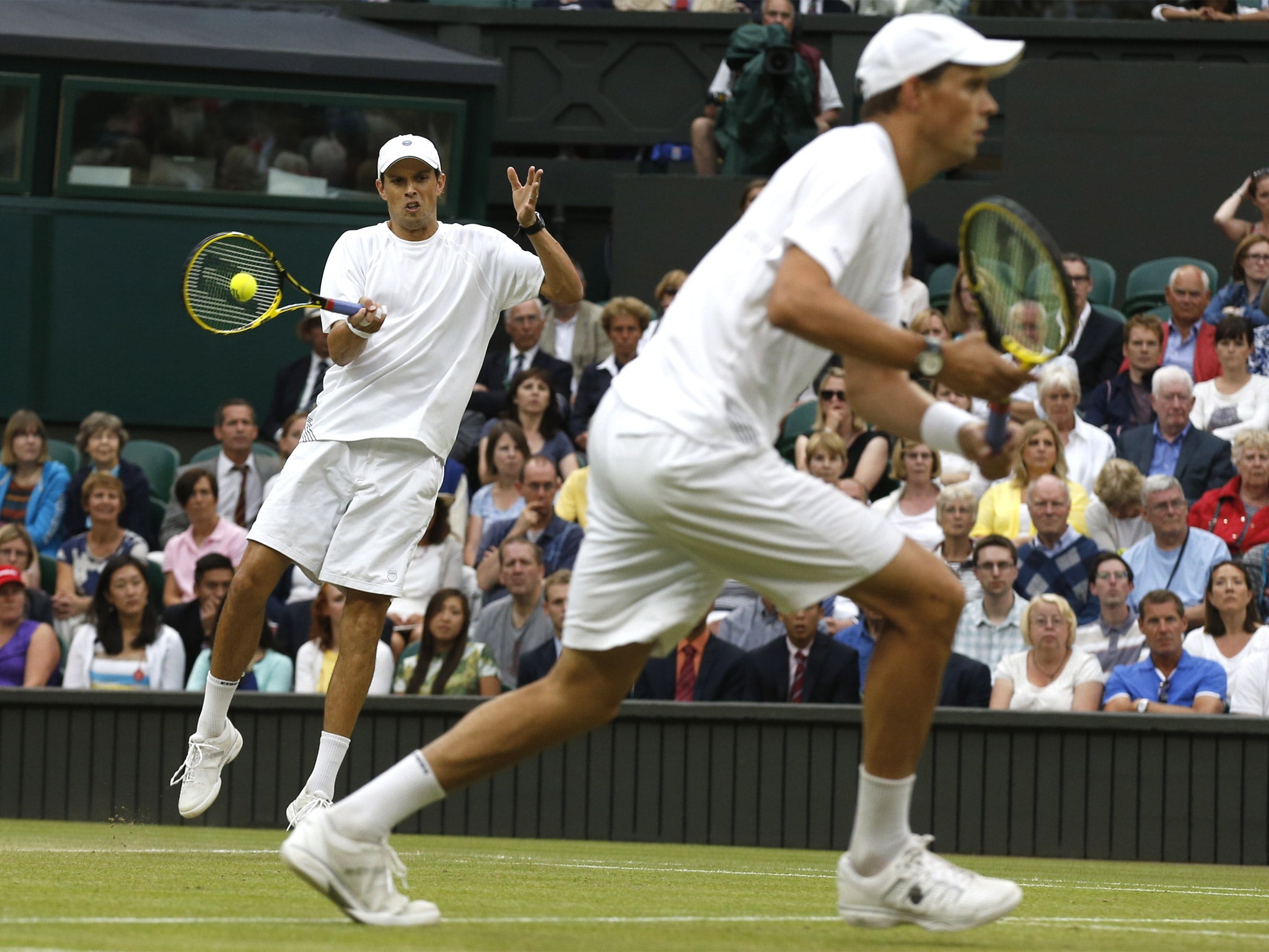 Bob and Mike Bryan (left) lost in five sets to Jack Sock and Vasek Pospisil