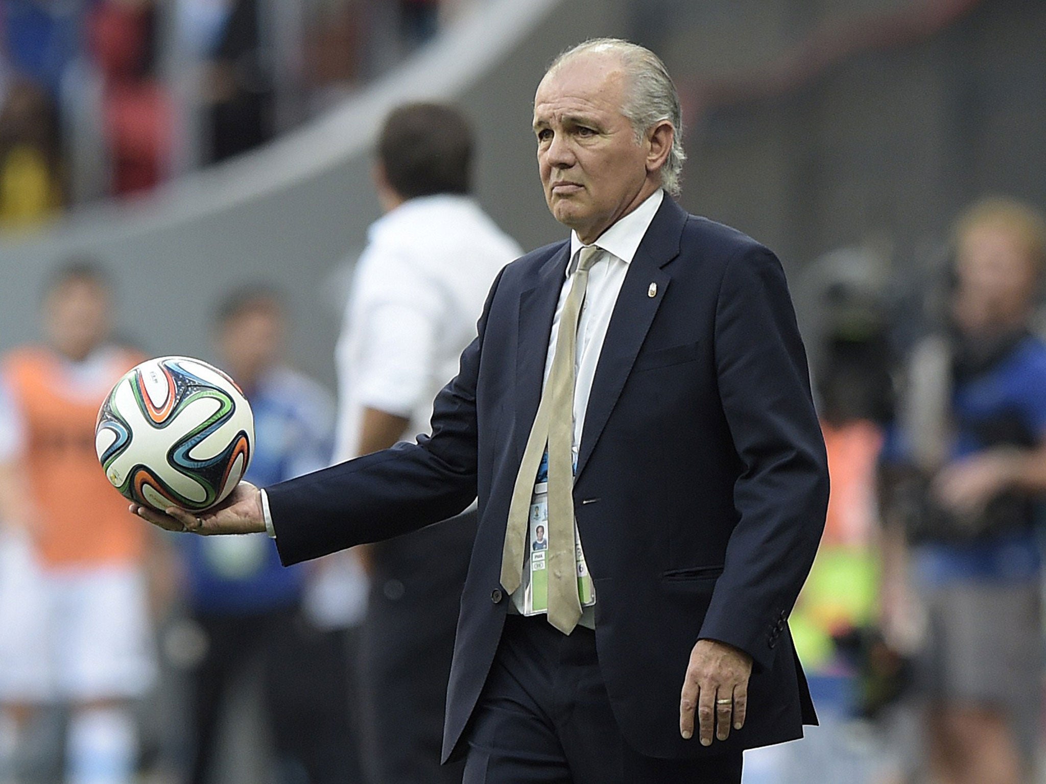 Argentina's coach Alejandro Sabella holds the ball during a quarter-final football match between Argentina and Belgium at the Mane Garrincha National Stadium