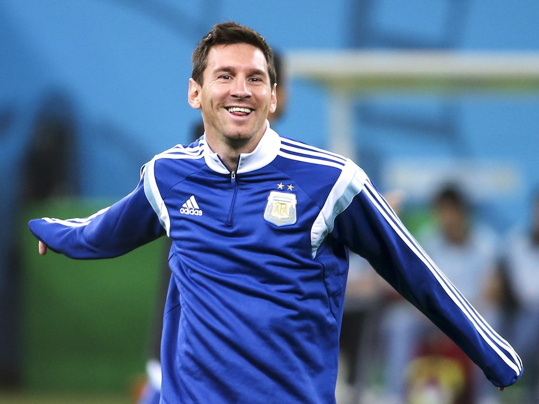 Argentina's national soccer team player Lionel Messi warms up during their training session in Sao Paulo