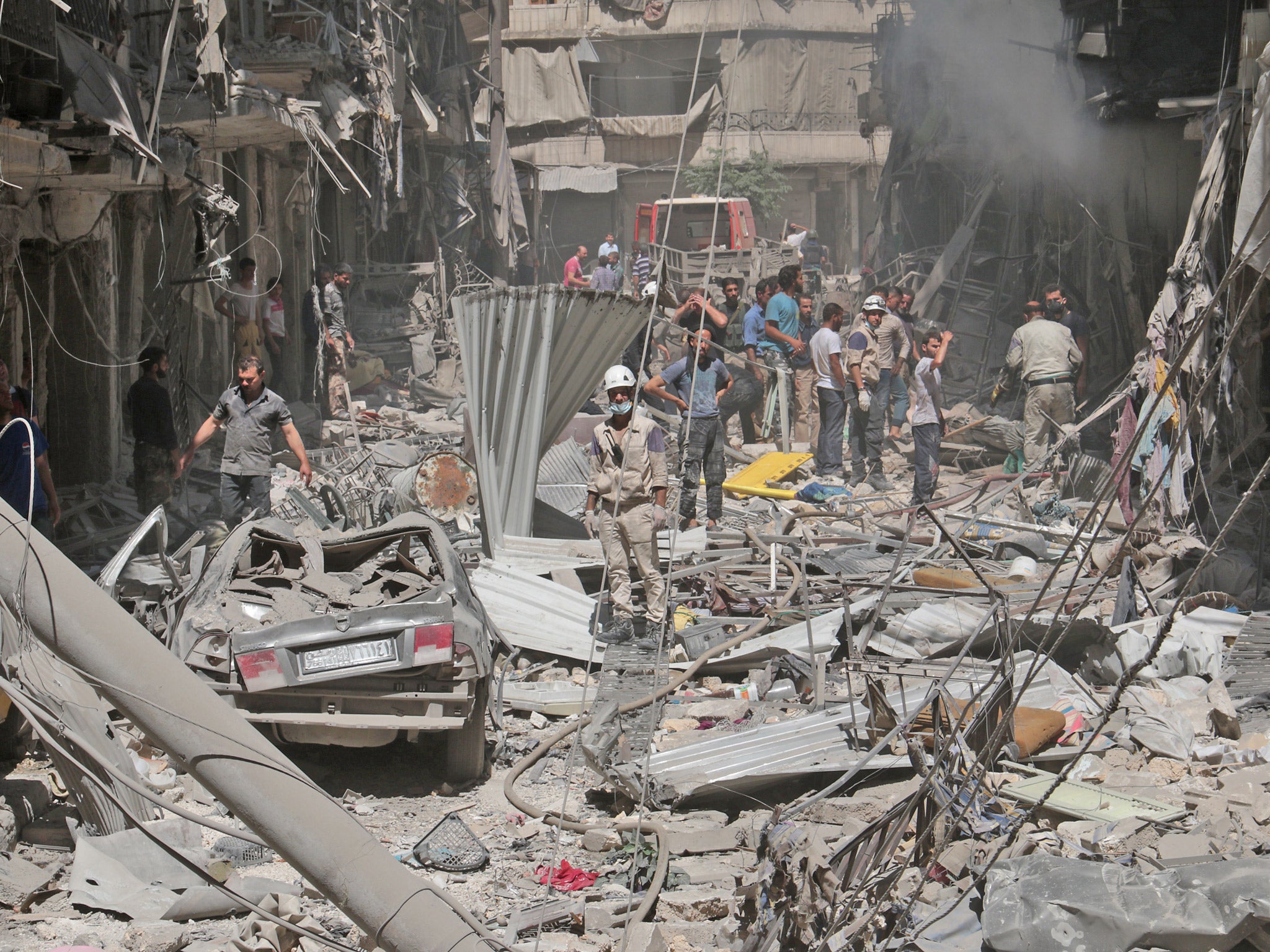 Destruction is seen following a reported barrel-bomb attack by Syrian government forces in the northern city of Aleppo