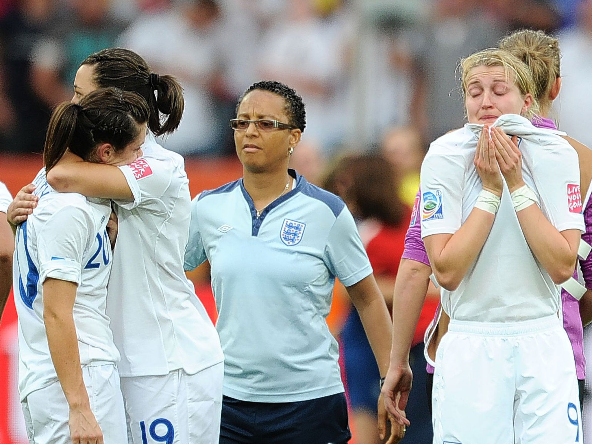 Dejection for Hope Powell (centre) and the England players after their penalty shoot-out defeat to France at the 2011 Women’s World Cup