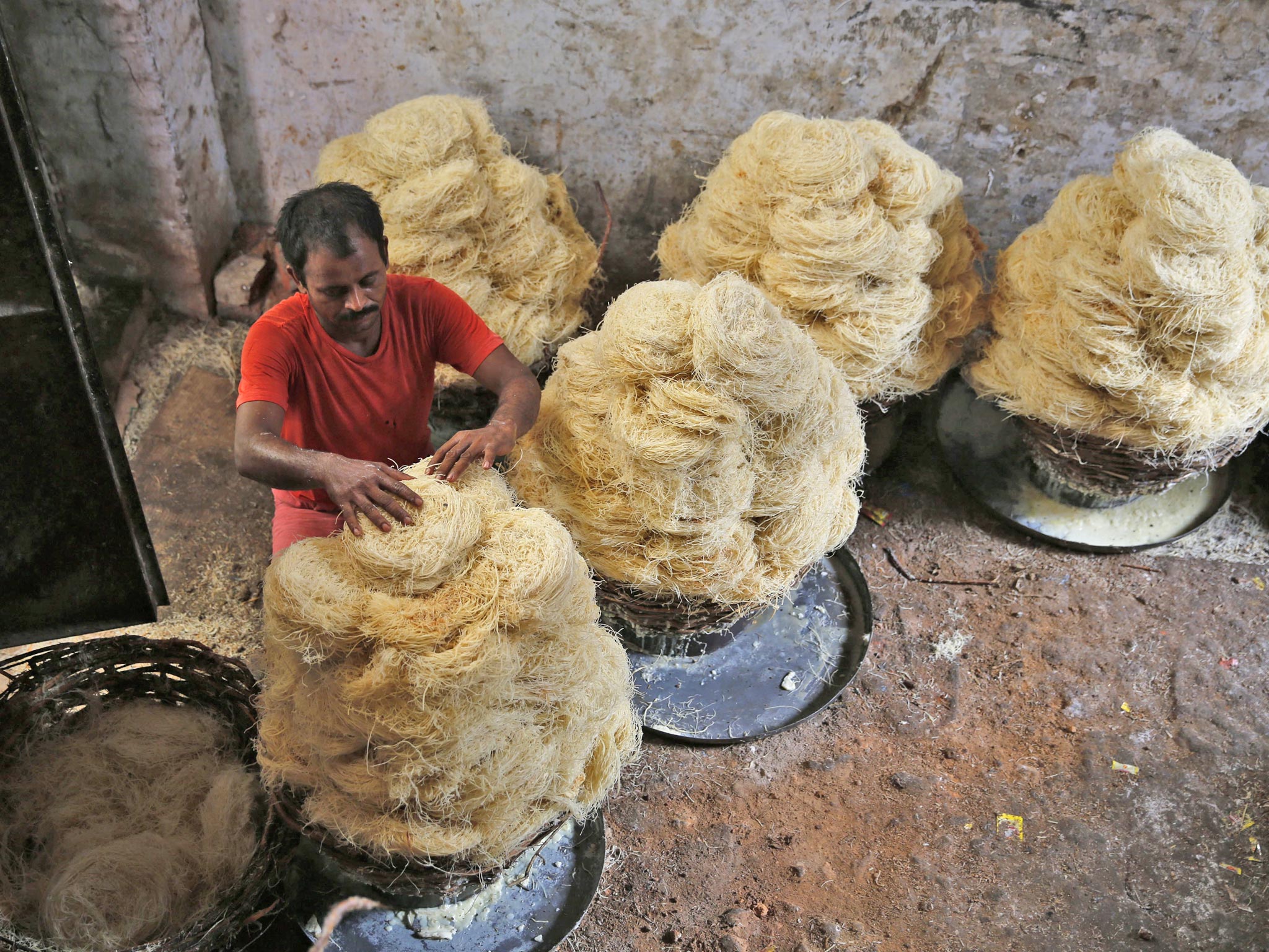 A worker arranges pasta at a factory in Allahabad. India’s
finance minister said he hoped that growth would soon
reach 7 or 8 per cent