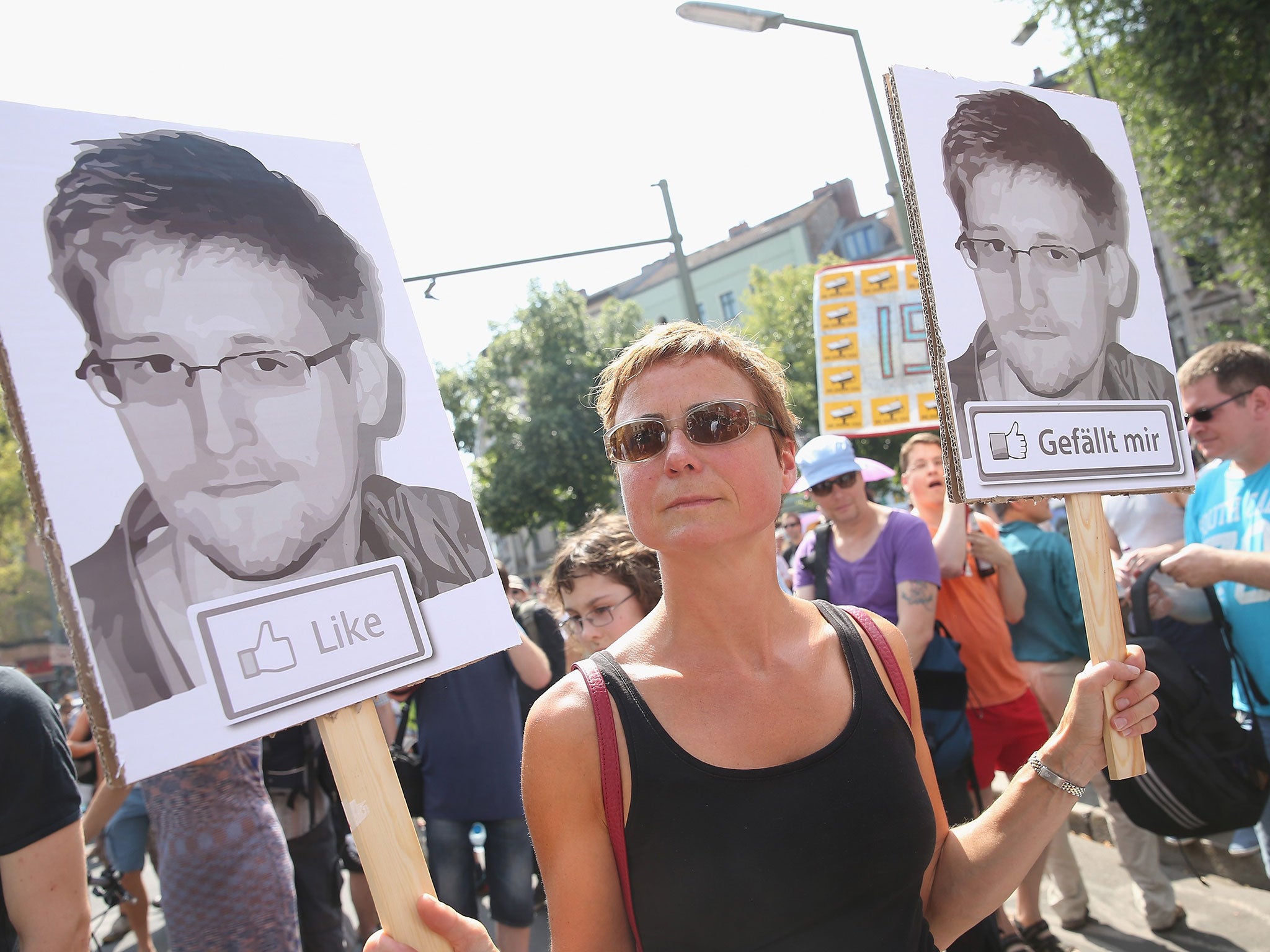 A participant demonstrates in support of former NSA employee Edward Snowden