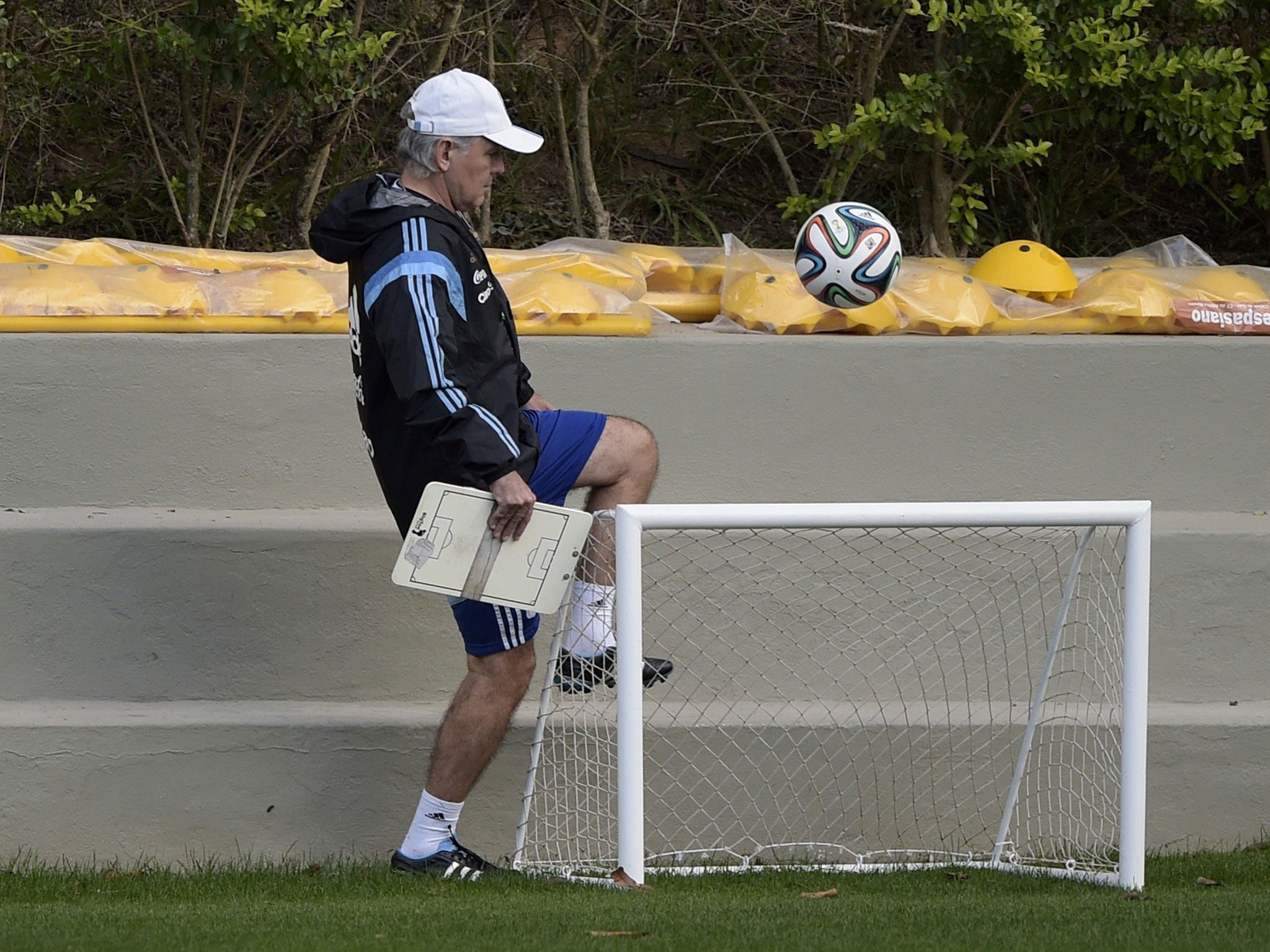 Argentina's coach Alejandro Sabella juggles a ball during a training session