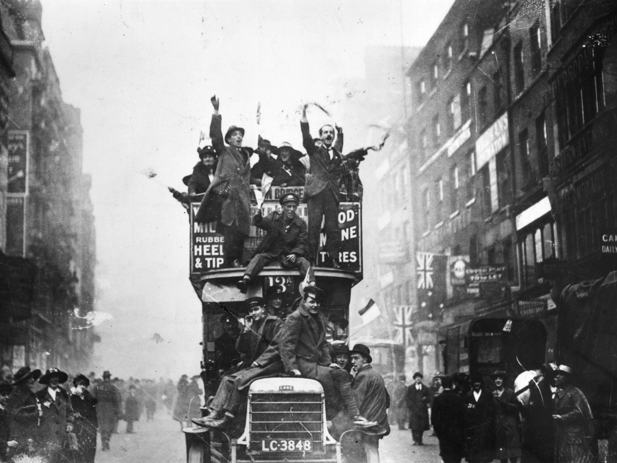 Crowds in London celebrate the end of hostilities in 1918