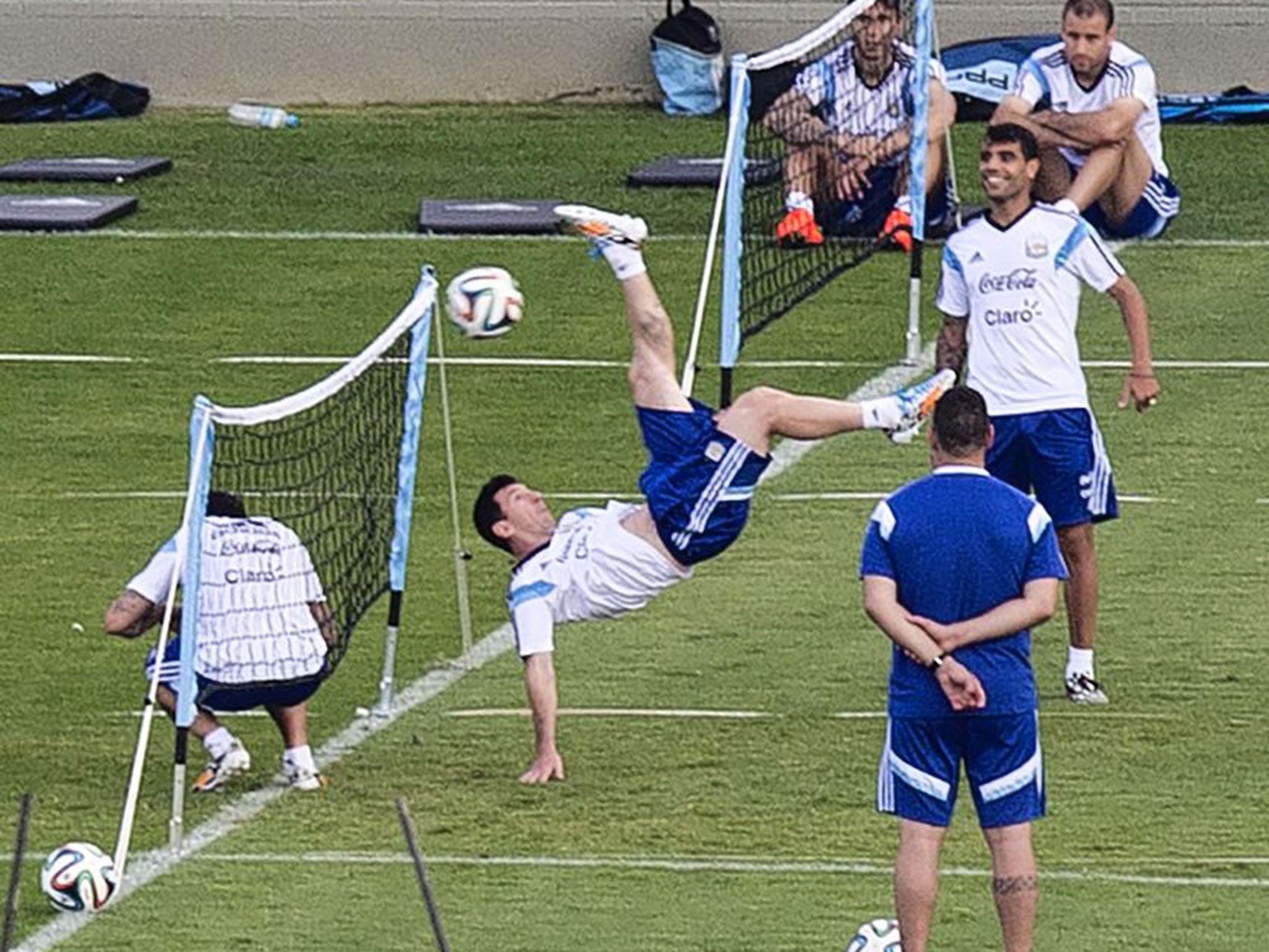 Messi attempts an overhead kick during training
