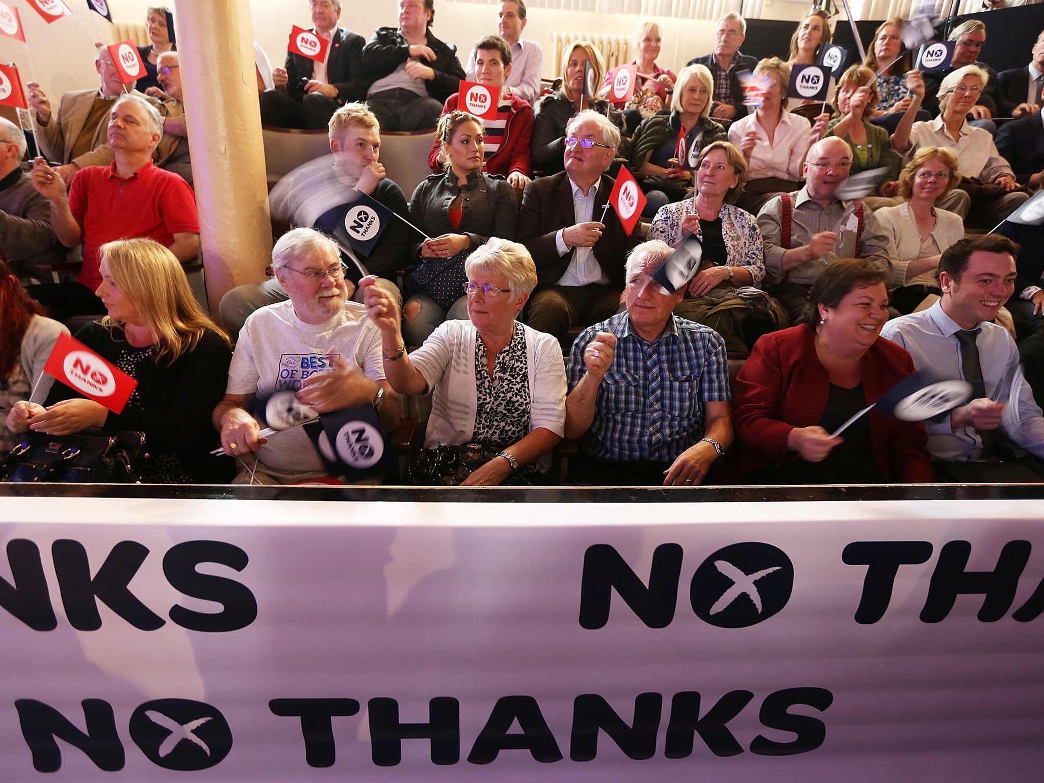 'Better Together' supporters wave their flags