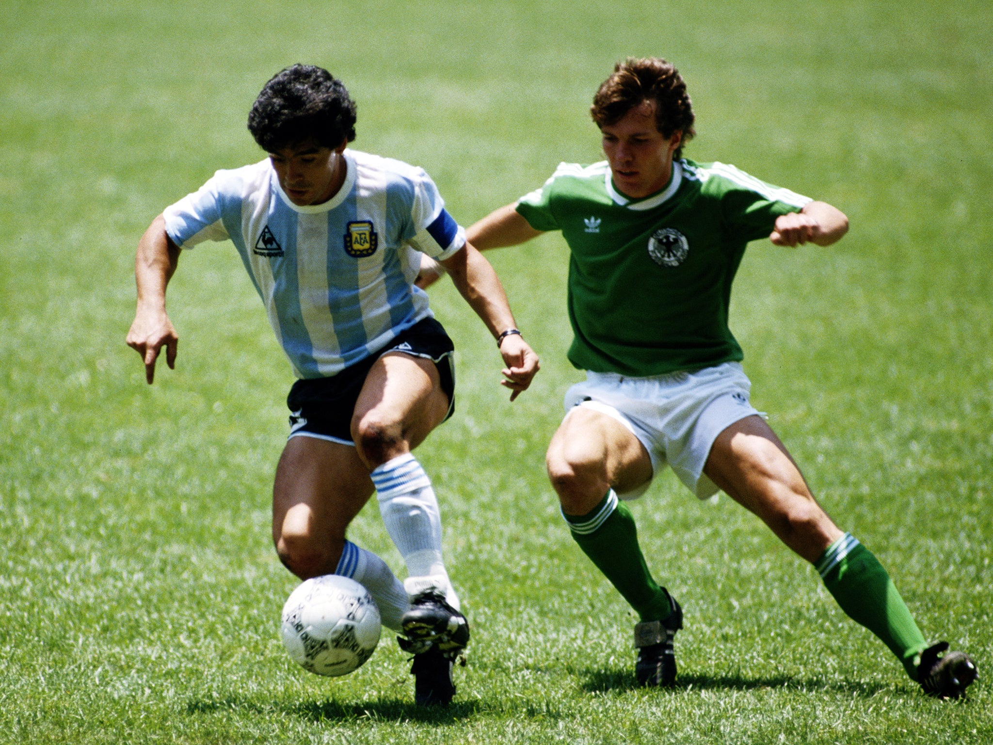 Diego Maradona of Argentina and Lothar Matthaeus of Germany in action during the 1986 World Cup final in Mexico