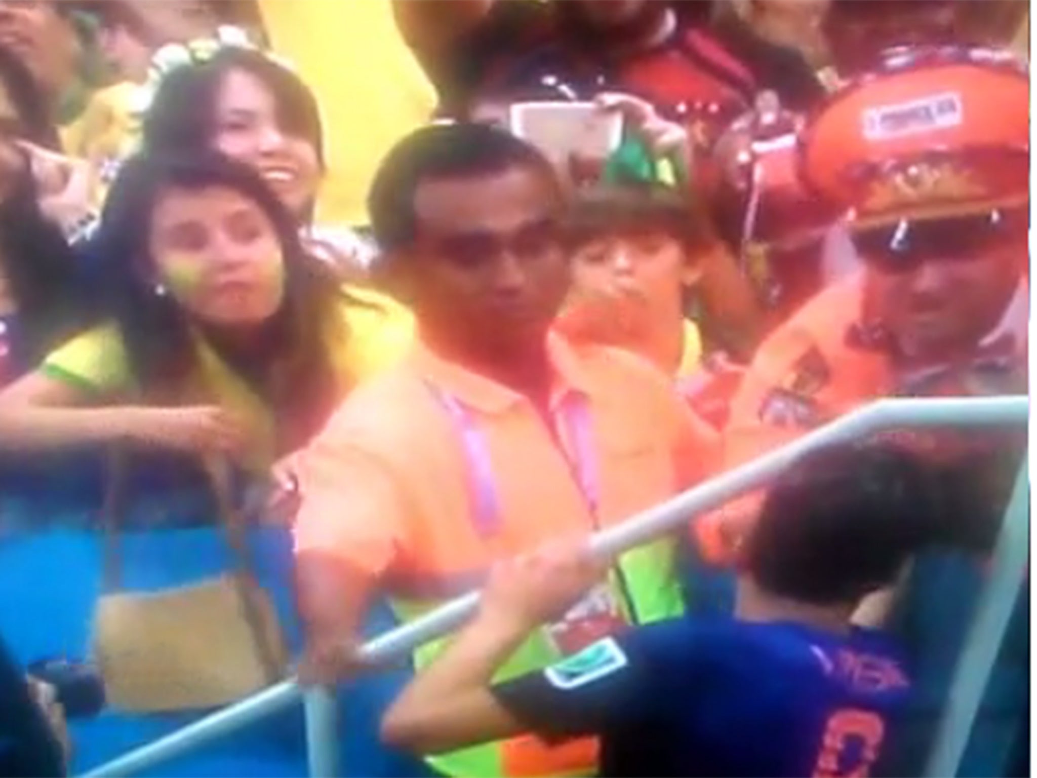 Robin van Persie hands his third-place medal to a supporter