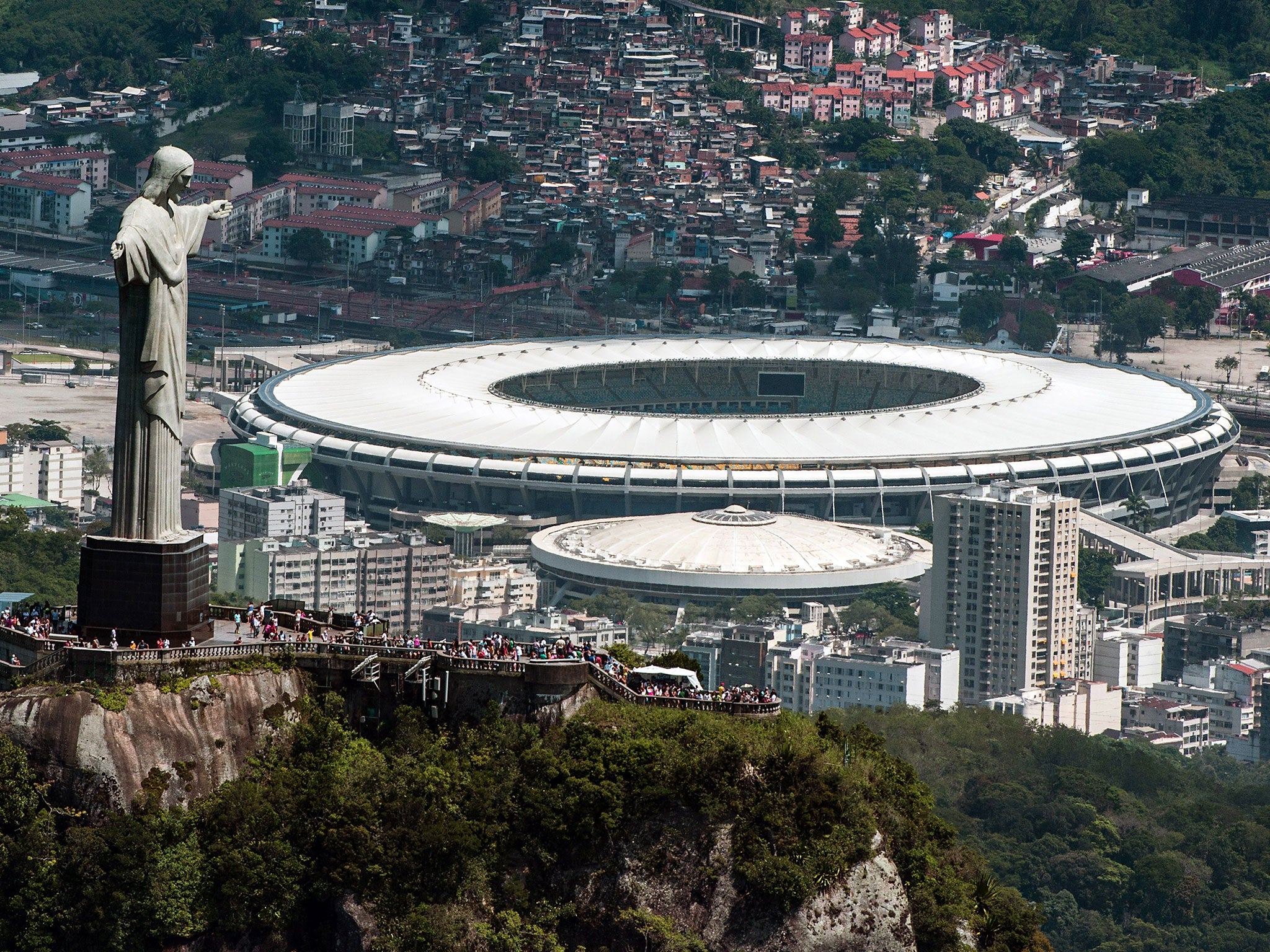 Aerial view of the Christ the Redeemer statue atop Corcovado Hill and the Mario Filho (Maracana) stadium in Rio de Janeiro, Brazil, on December 3, 2013.