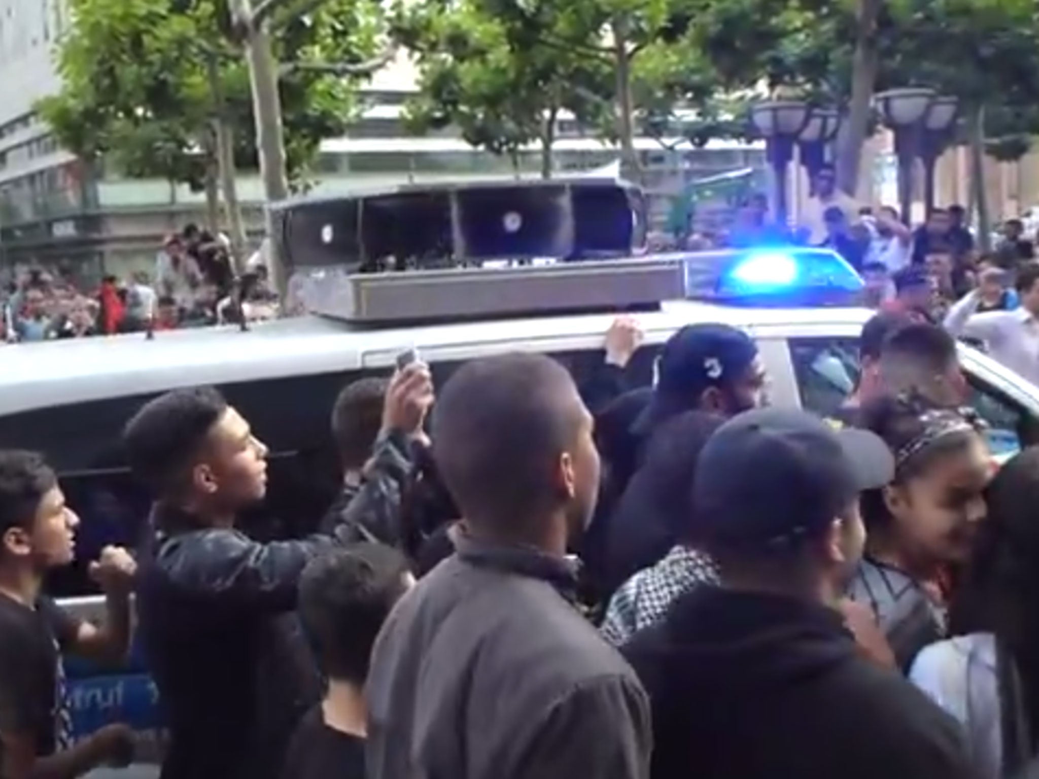 Police in Frankfurt were filmed agreeing to let an anti-Israel protester use the megaphone in this van - and they proceeded to use it to work up the crowd even more