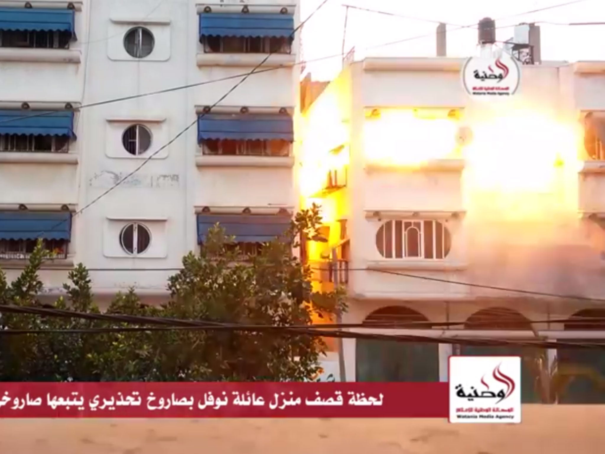 A still from the video footage which shows the Israeli military's 'knock on the roof' technique