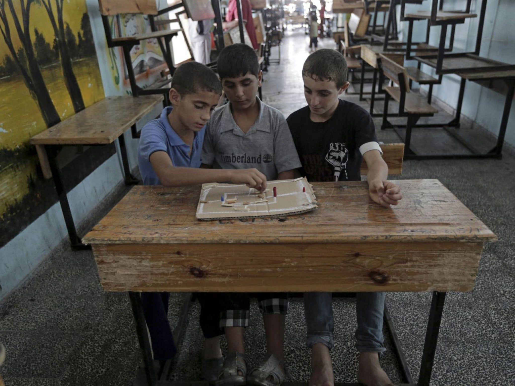 Boys play in a now abandoned school