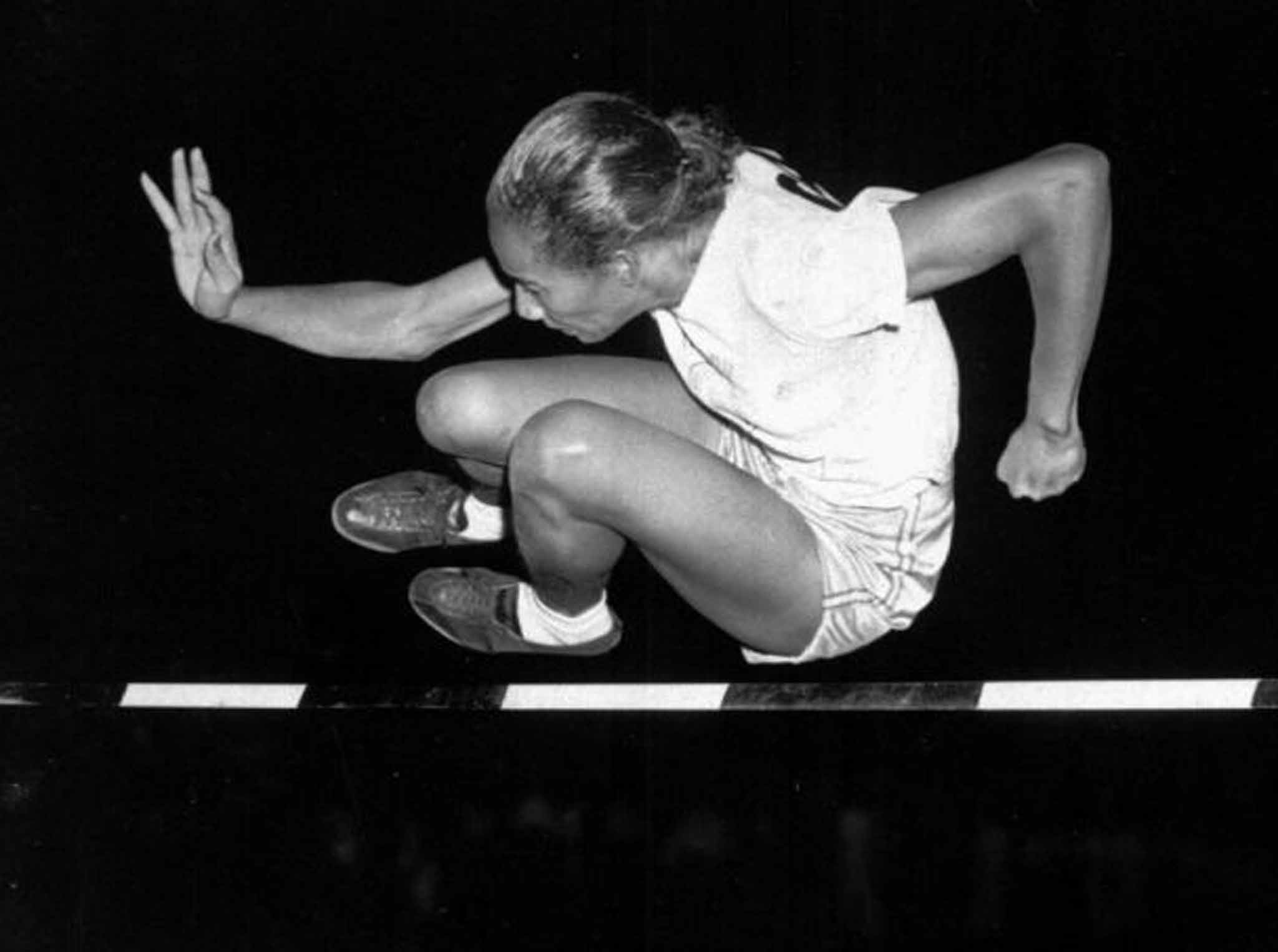 Davis in 1948, on her way to victory at a meet in Iowa; she was banned from using public sports facilities