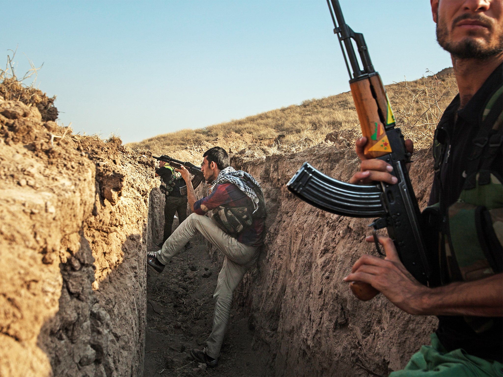 Turkey is to allow Iraqi Kurdish fighters cross into Syria to join battle for Kobani