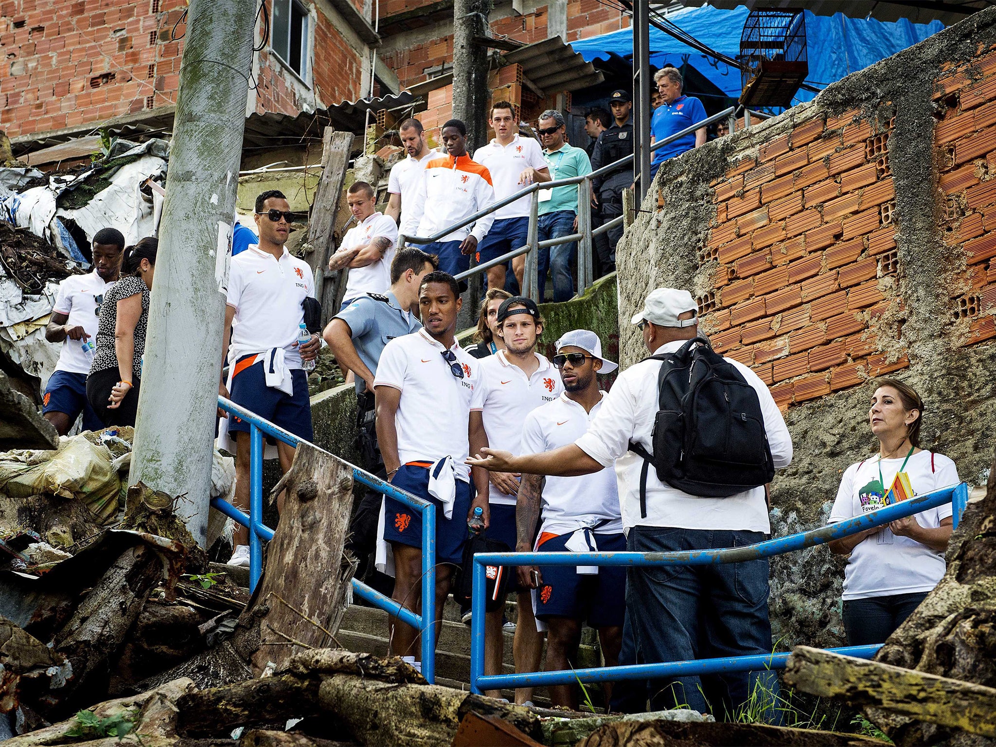 Members of the Dutch team are given a glimpse of life for many Brazilians during a tour of a favela during the World Cup