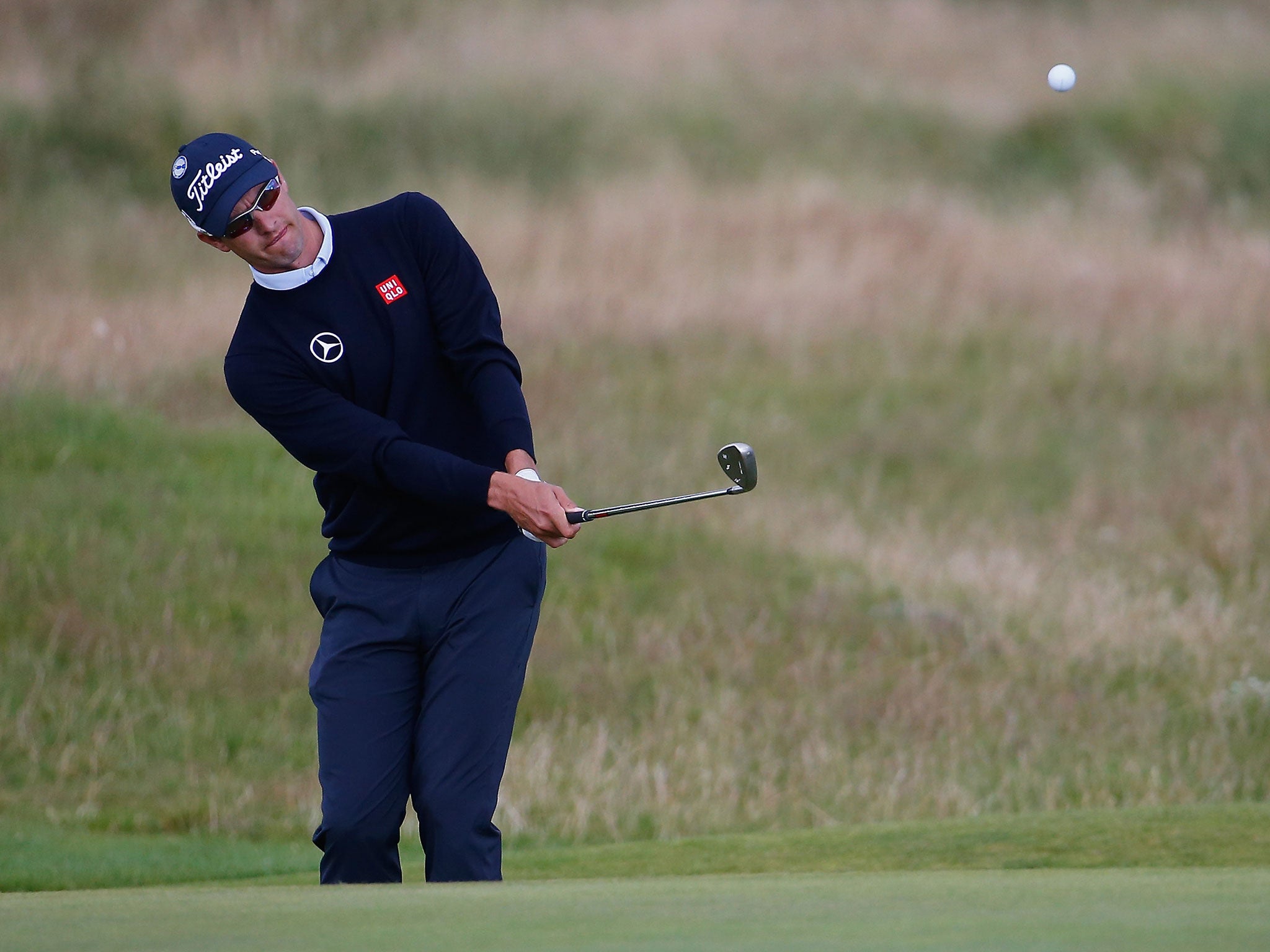 Adam Scott of Australia plays an iron shot during a practice round prior to the start of the 143rd Open Championship at Royal Liverpool on July 14, 2014 in Hoylake.