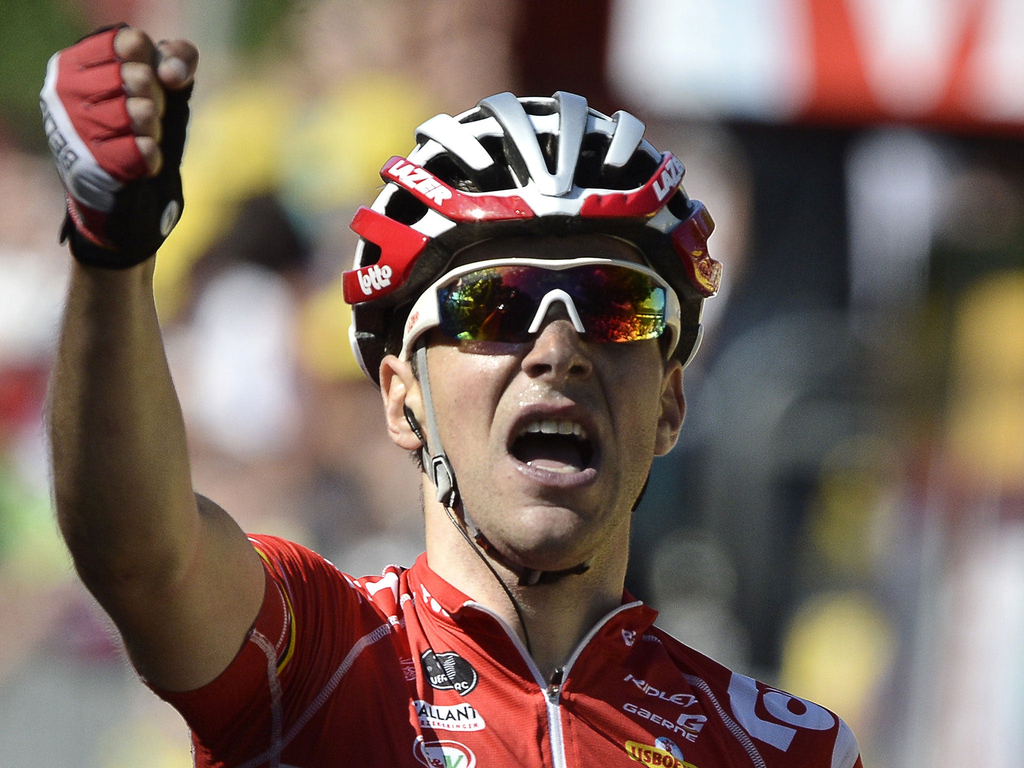 France's Tony Gallopin celebrates as he crosses the finish line