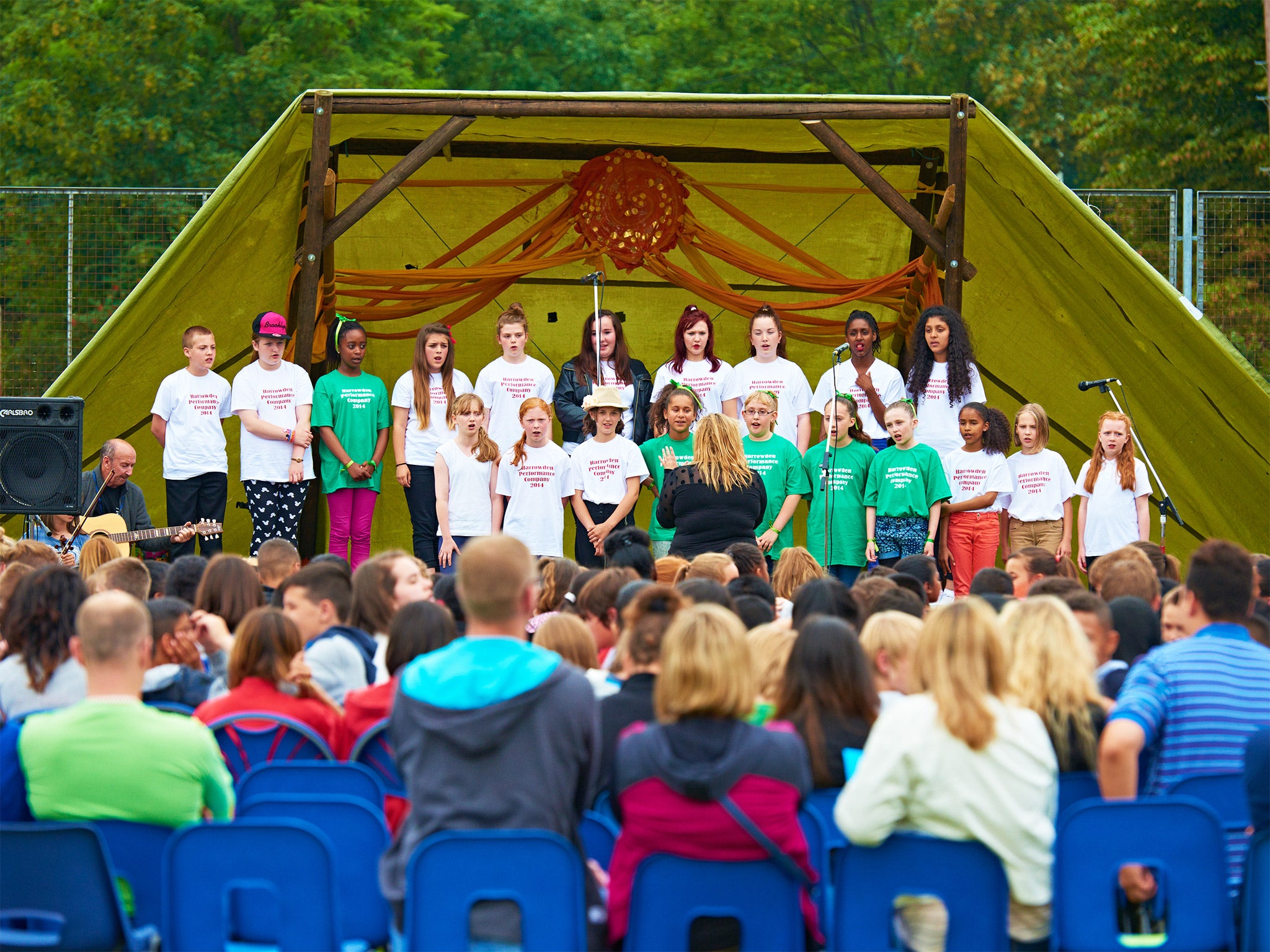 Children perform at the farewell party for Harrowden Middle School, which closes this week