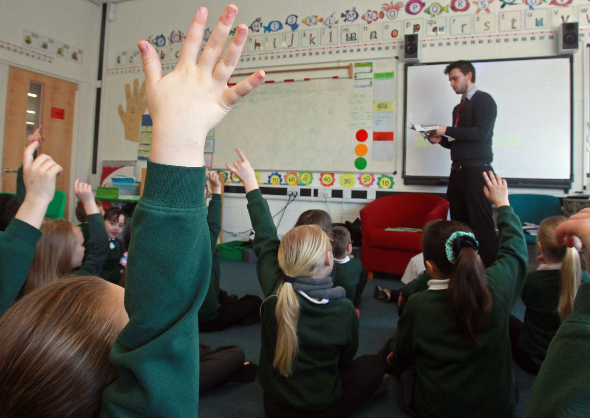School pupils at the Bridge Learning Campus answer questions in a classroom at the school on February 24, 2010