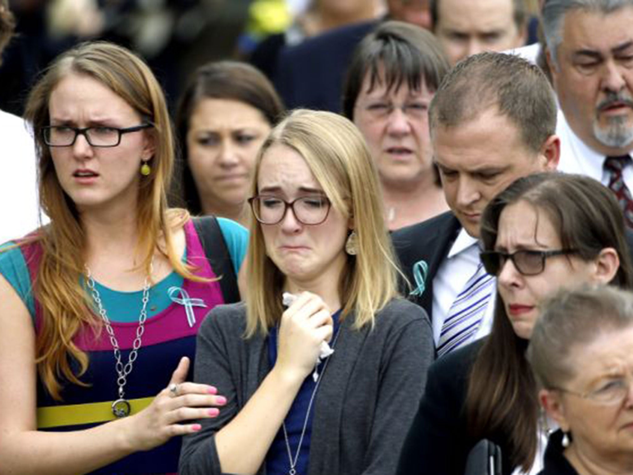 Cassidy Stay could barely hold back the tears as she saw the coffins buried