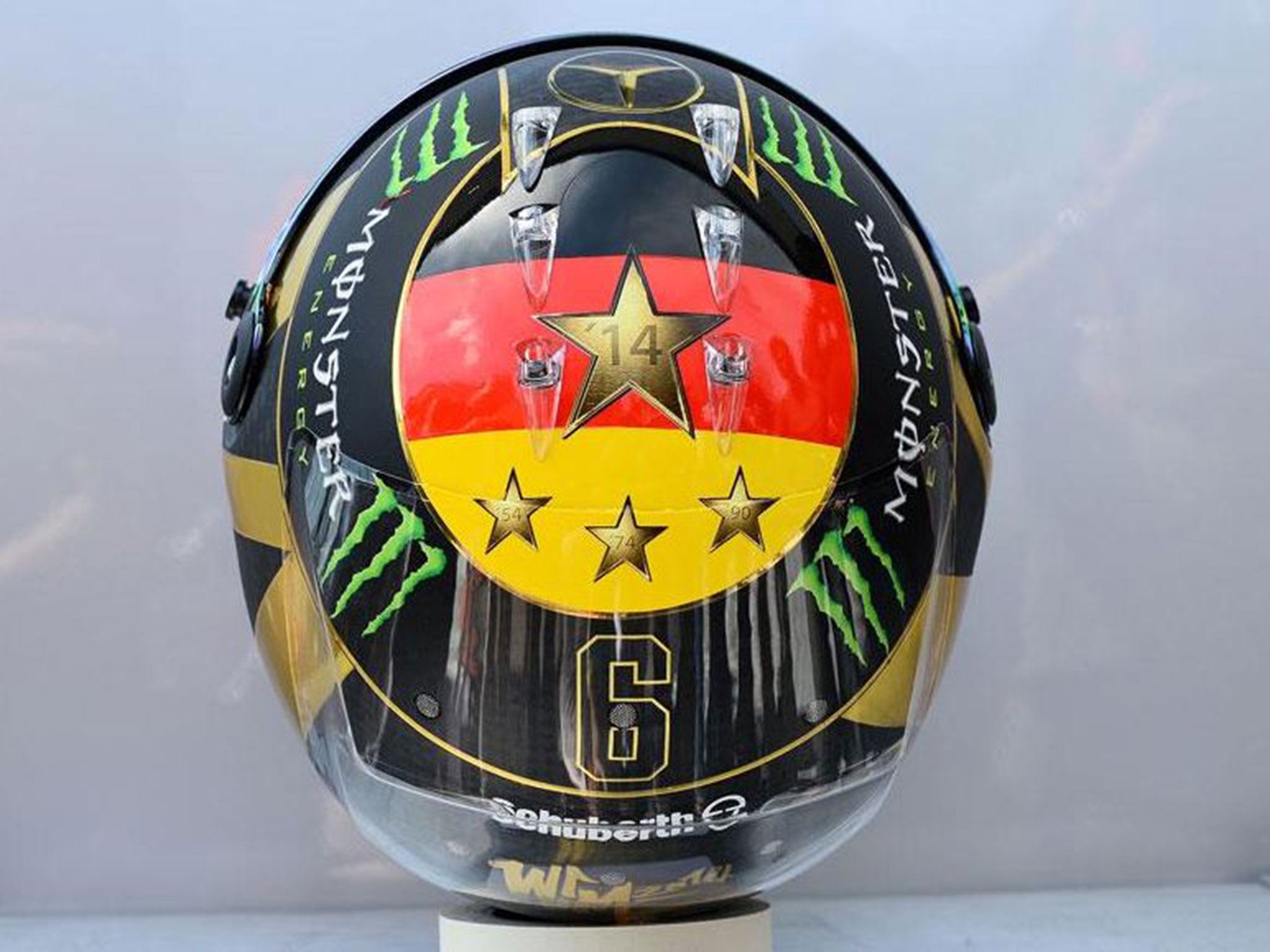 Nico Rosberg has had to change the planned design of his F1 helmet because it previously featured an image of the World Cup trophy